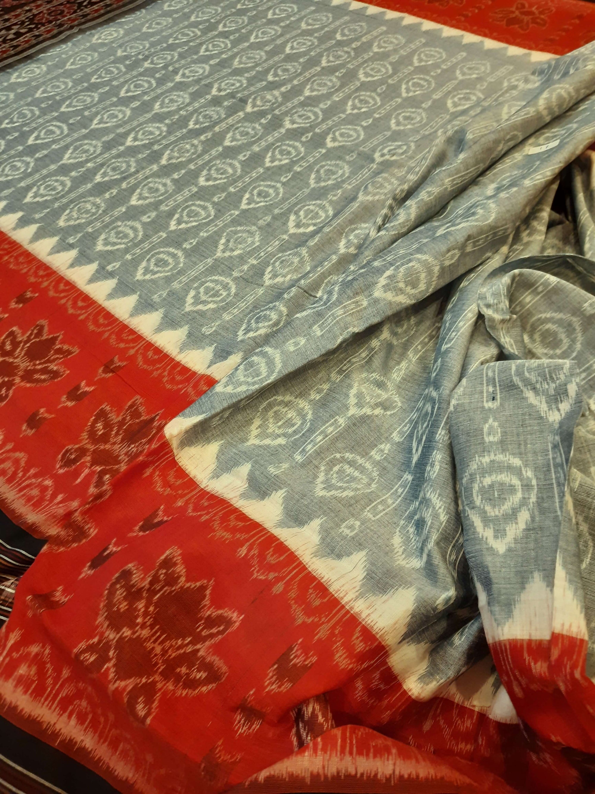 Green wide border Odisha Ikat saree with cotton ikat blouse piece