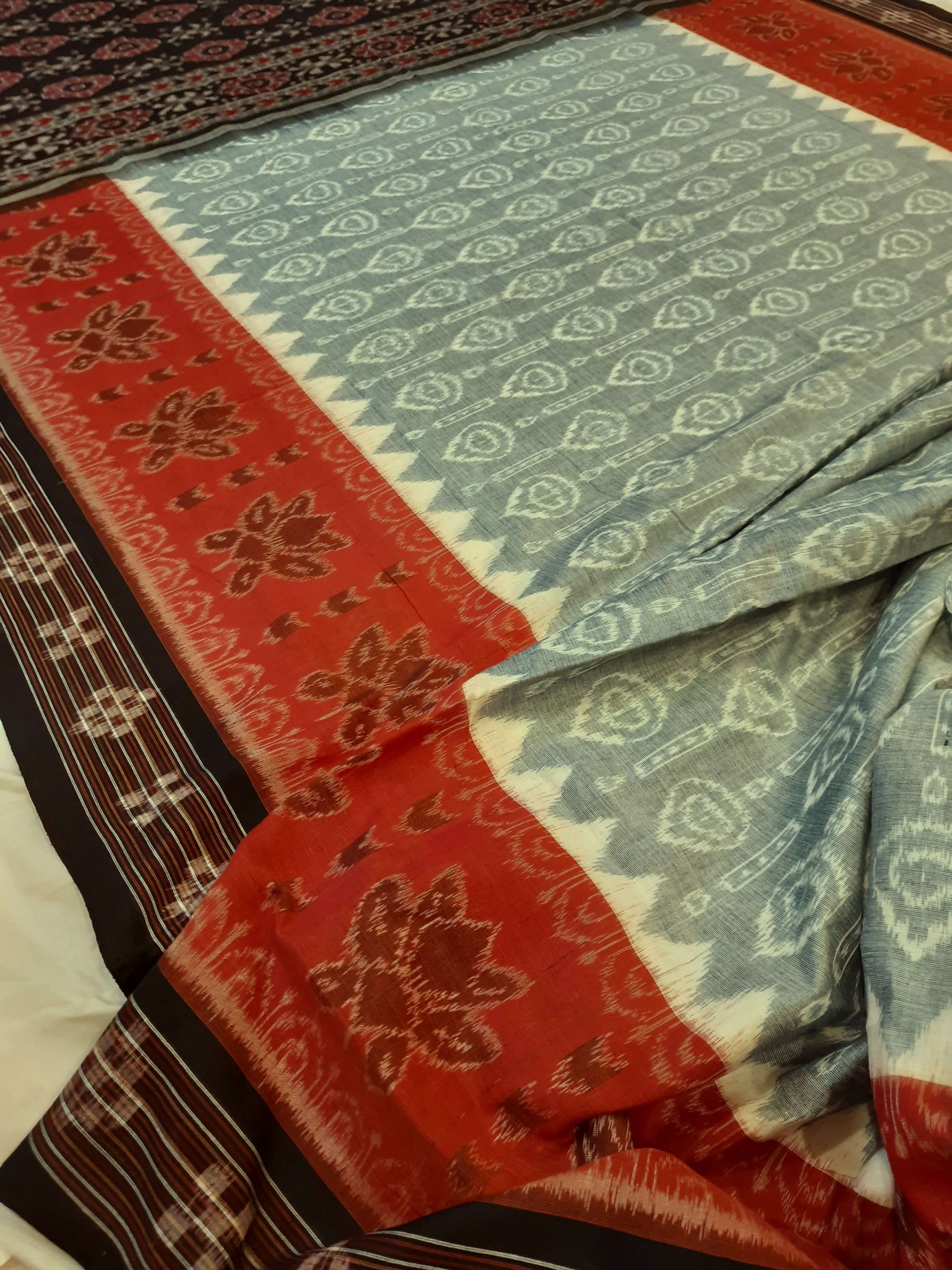 Green wide border Odisha Ikat saree with cotton ikat blouse piece