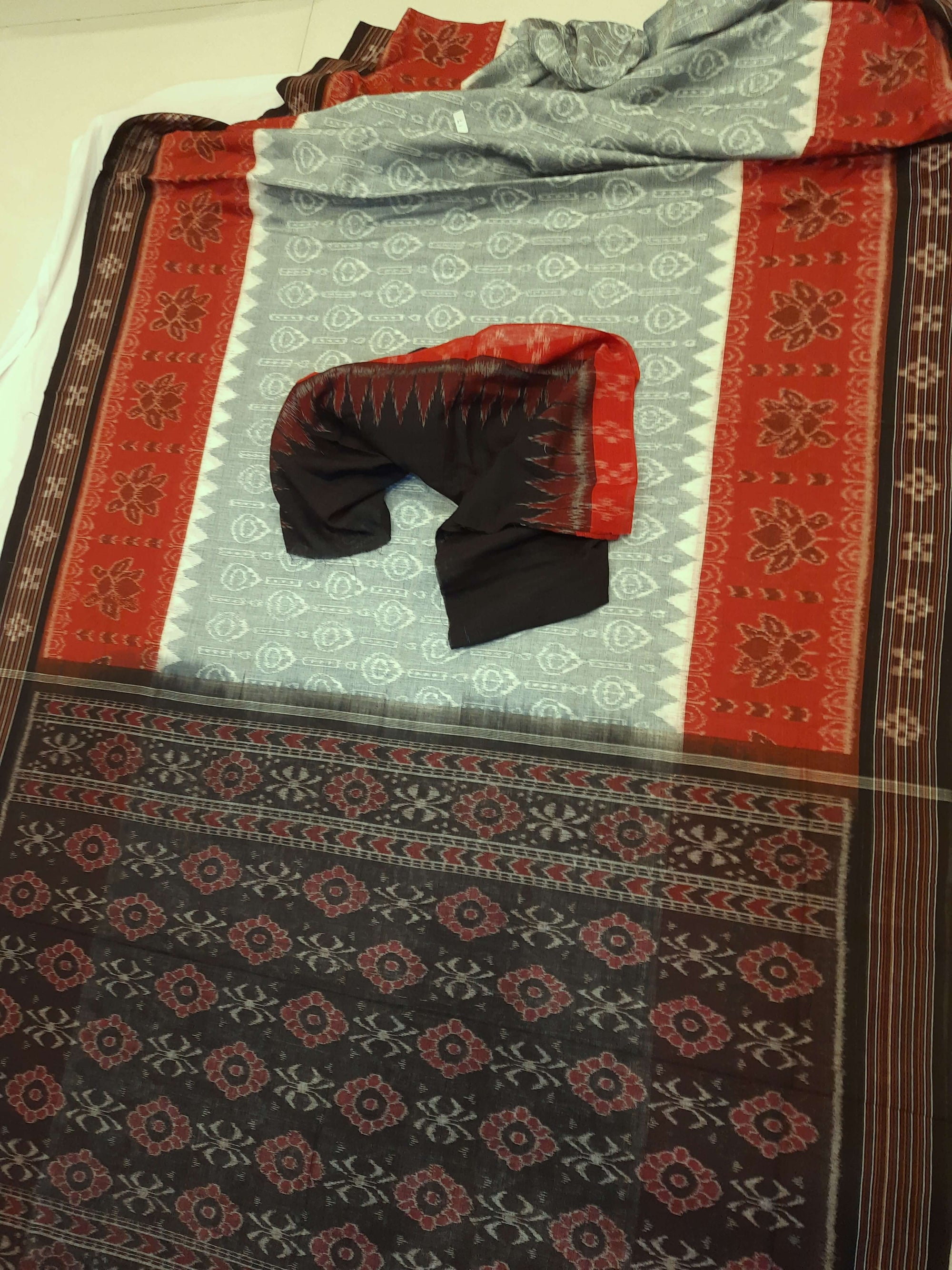 Green wide border Odisha Ikat saree with cotton ikat blouse piece