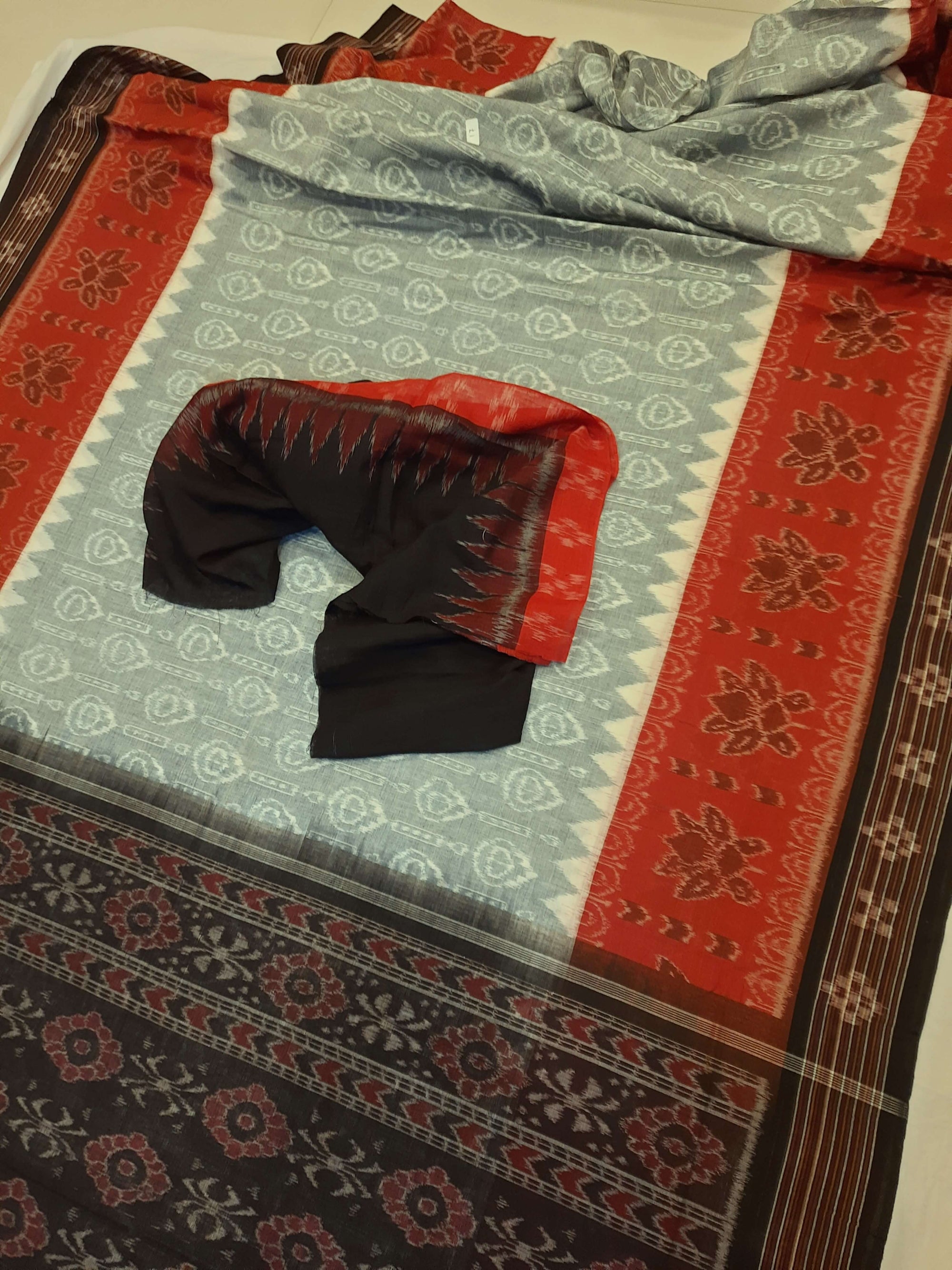 Green wide border Odisha Ikat saree with cotton ikat blouse piece