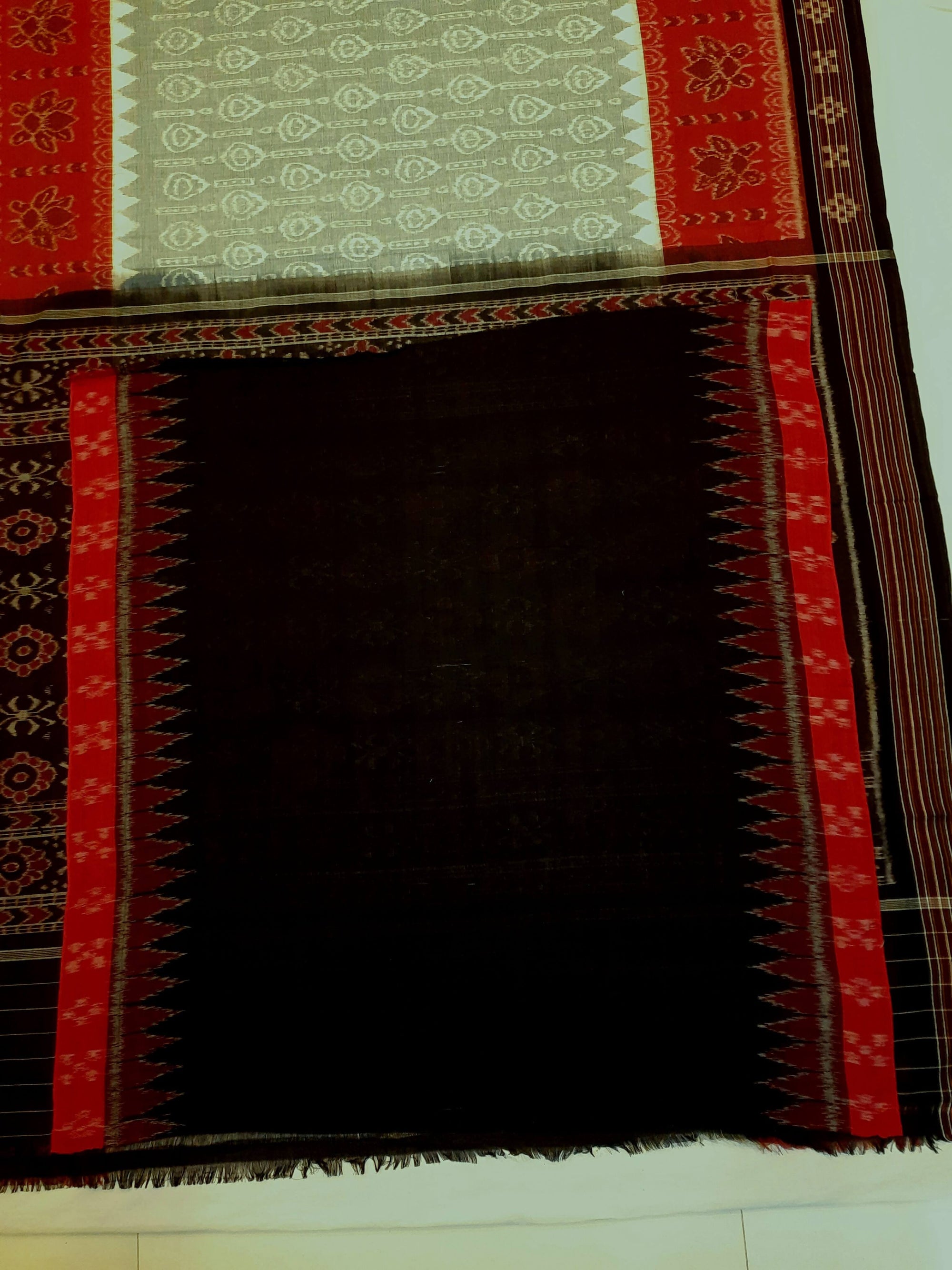 Green wide border Odisha Ikat saree with cotton ikat blouse piece