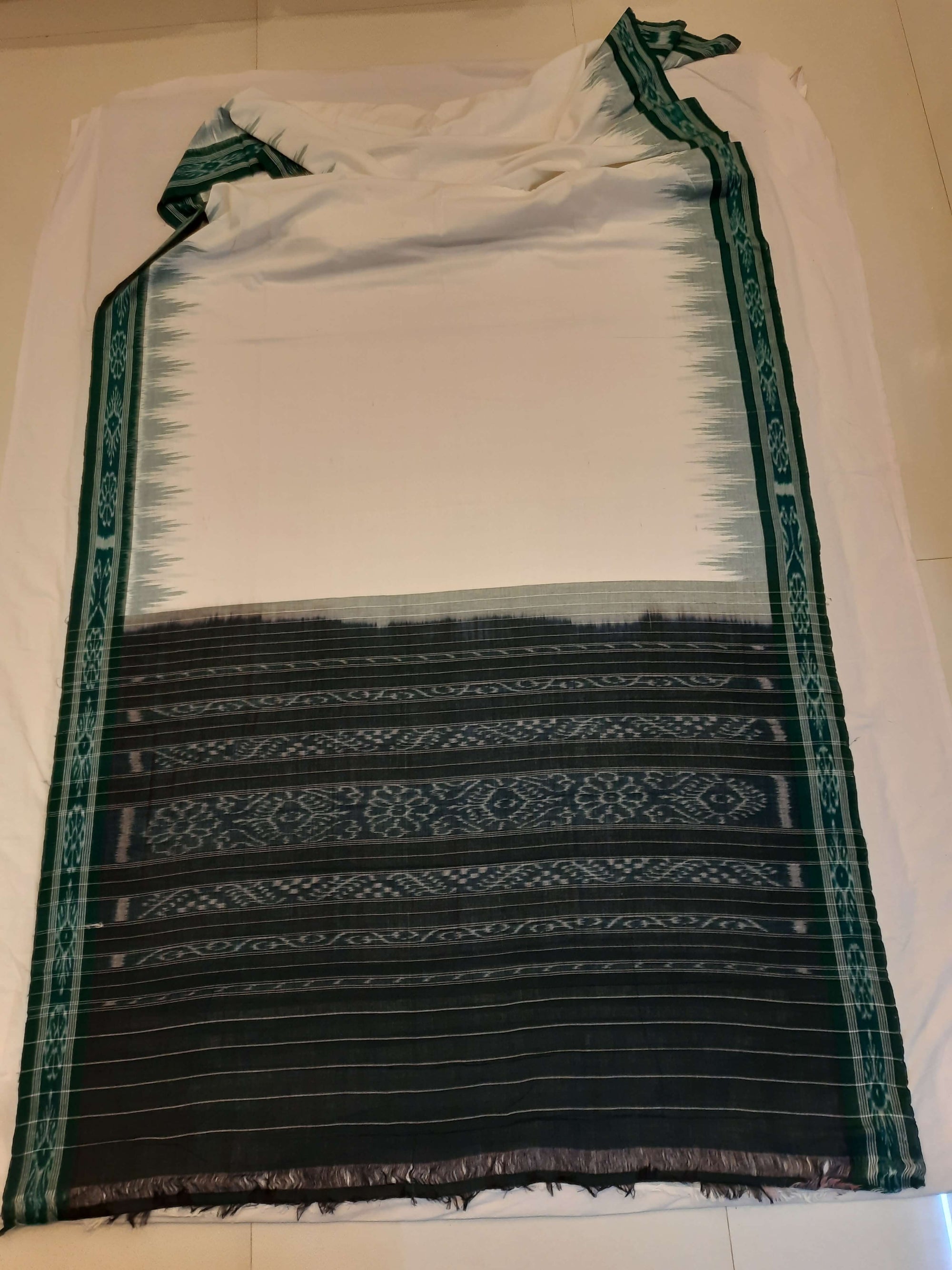 White with Green Odisha Ikat saree with cotton ikat blouse piece