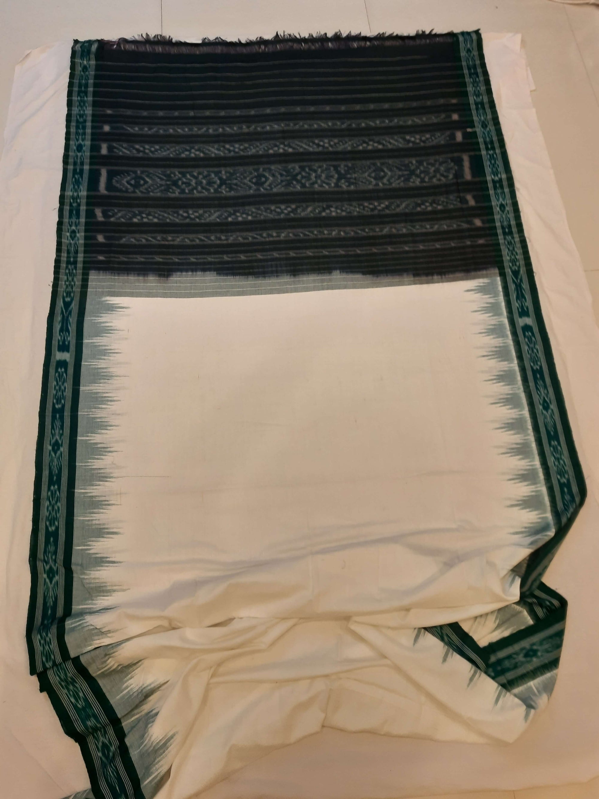 White with Green Odisha Ikat saree with cotton ikat blouse piece