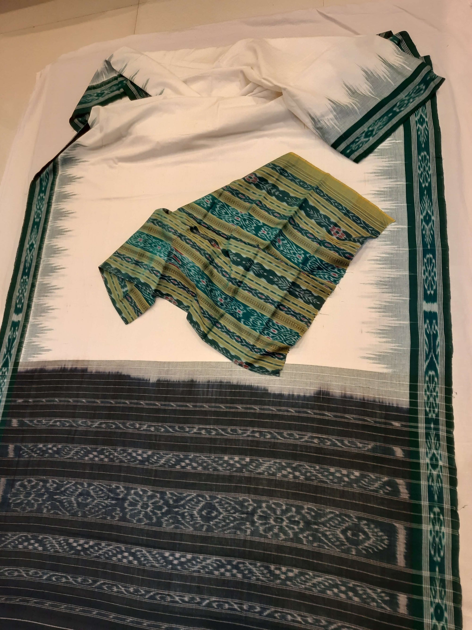 White with Green Odisha Ikat saree with cotton ikat blouse piece