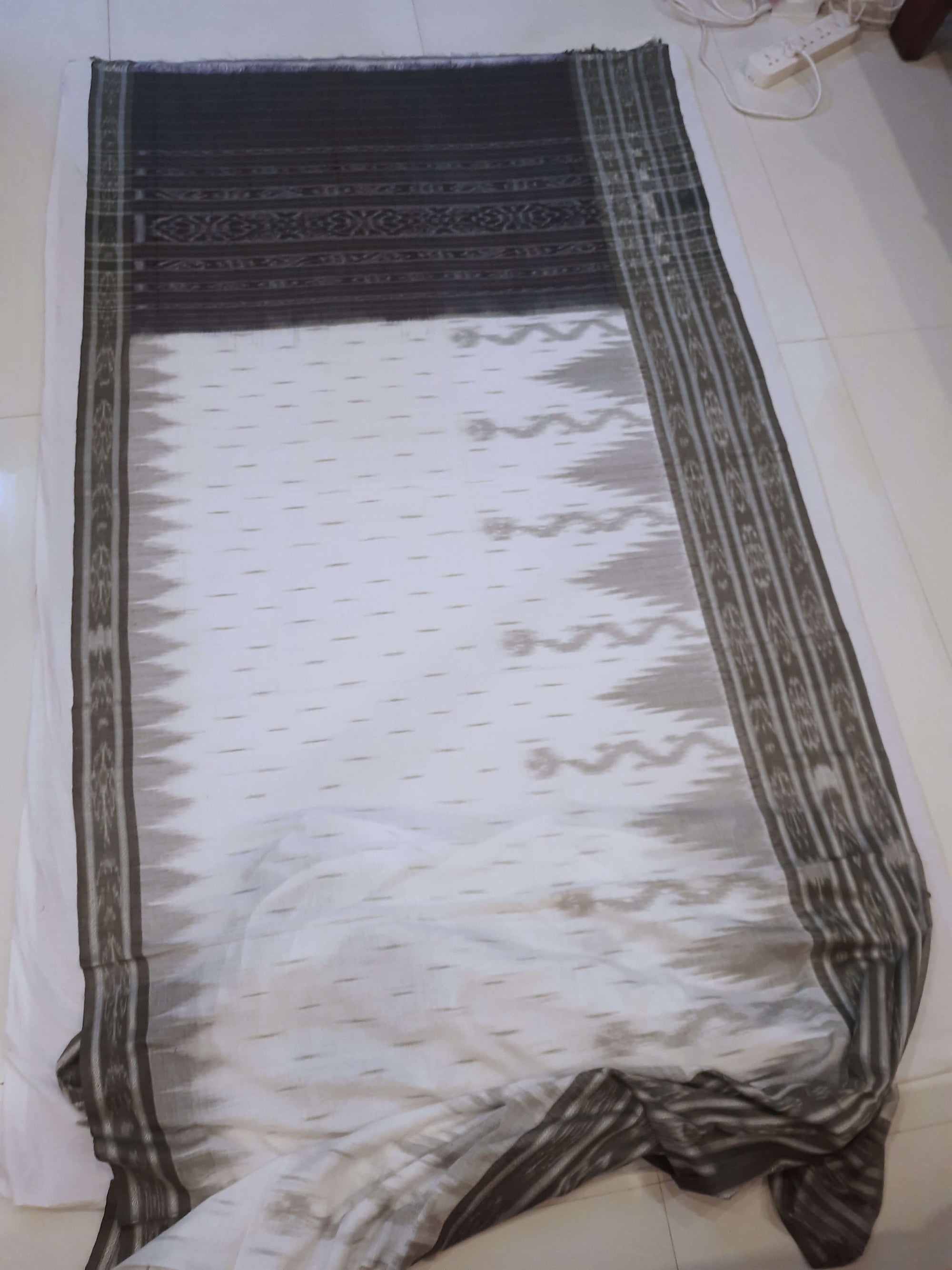 White wide border Cotton Odisha Ikat saree with mix match cotton ikat blouse