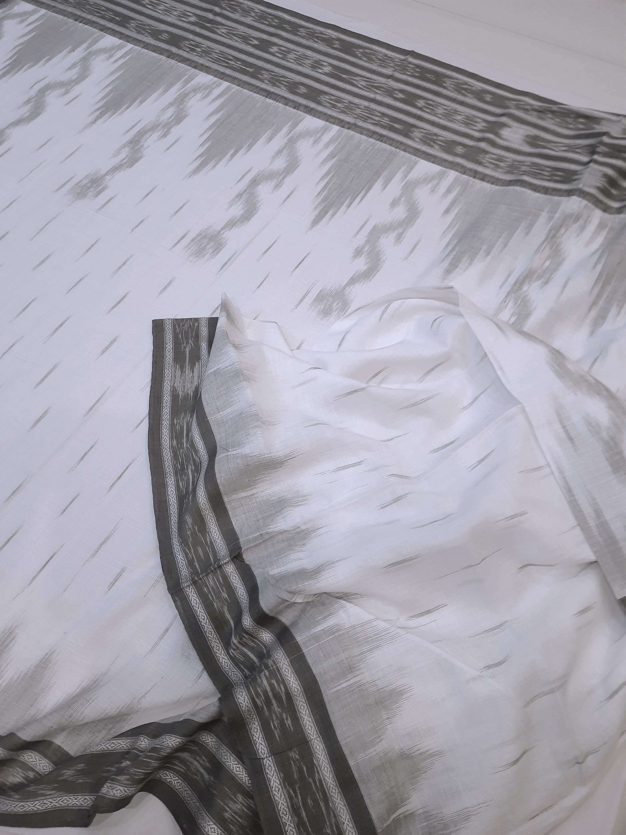 White wide border Cotton Odisha Ikat saree with mix match cotton ikat blouse