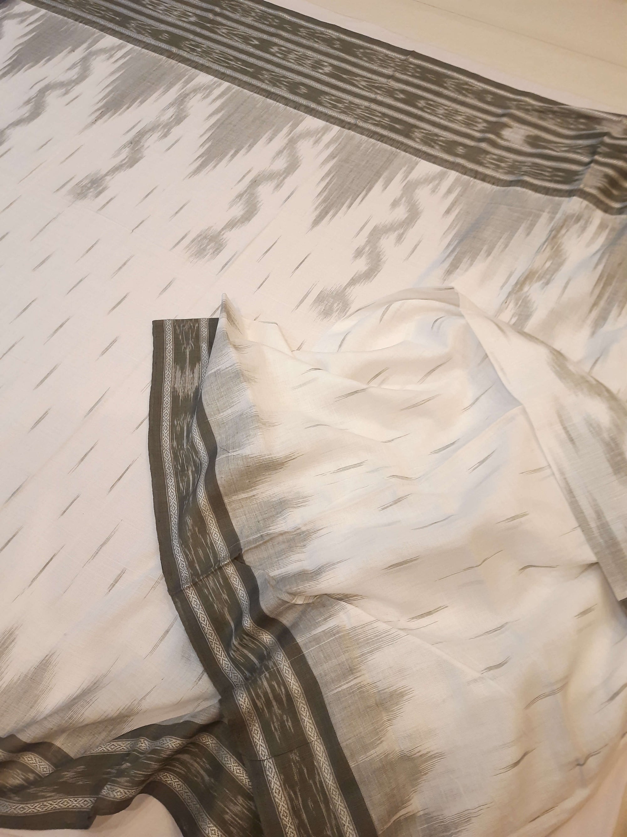 White wide border Cotton Odisha Ikat saree with mix match cotton ikat blouse