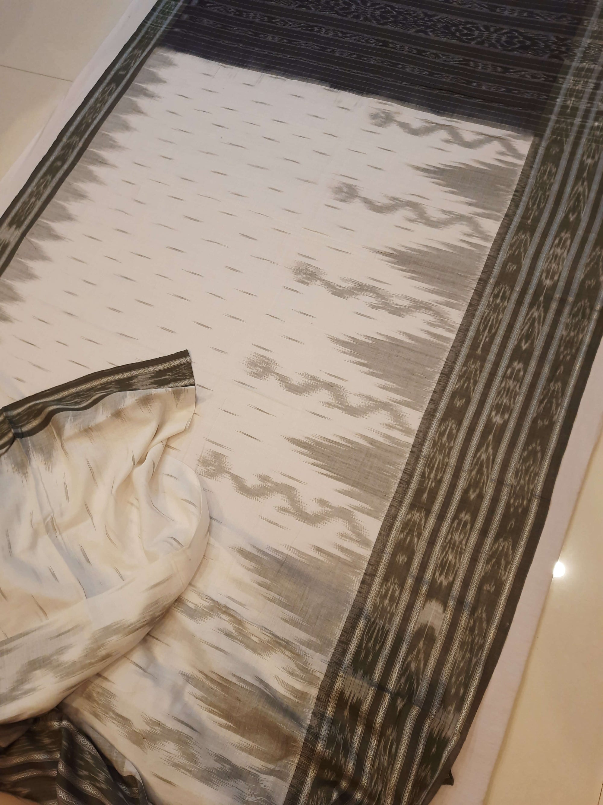 White wide border Cotton Odisha Ikat saree with mix match cotton ikat blouse