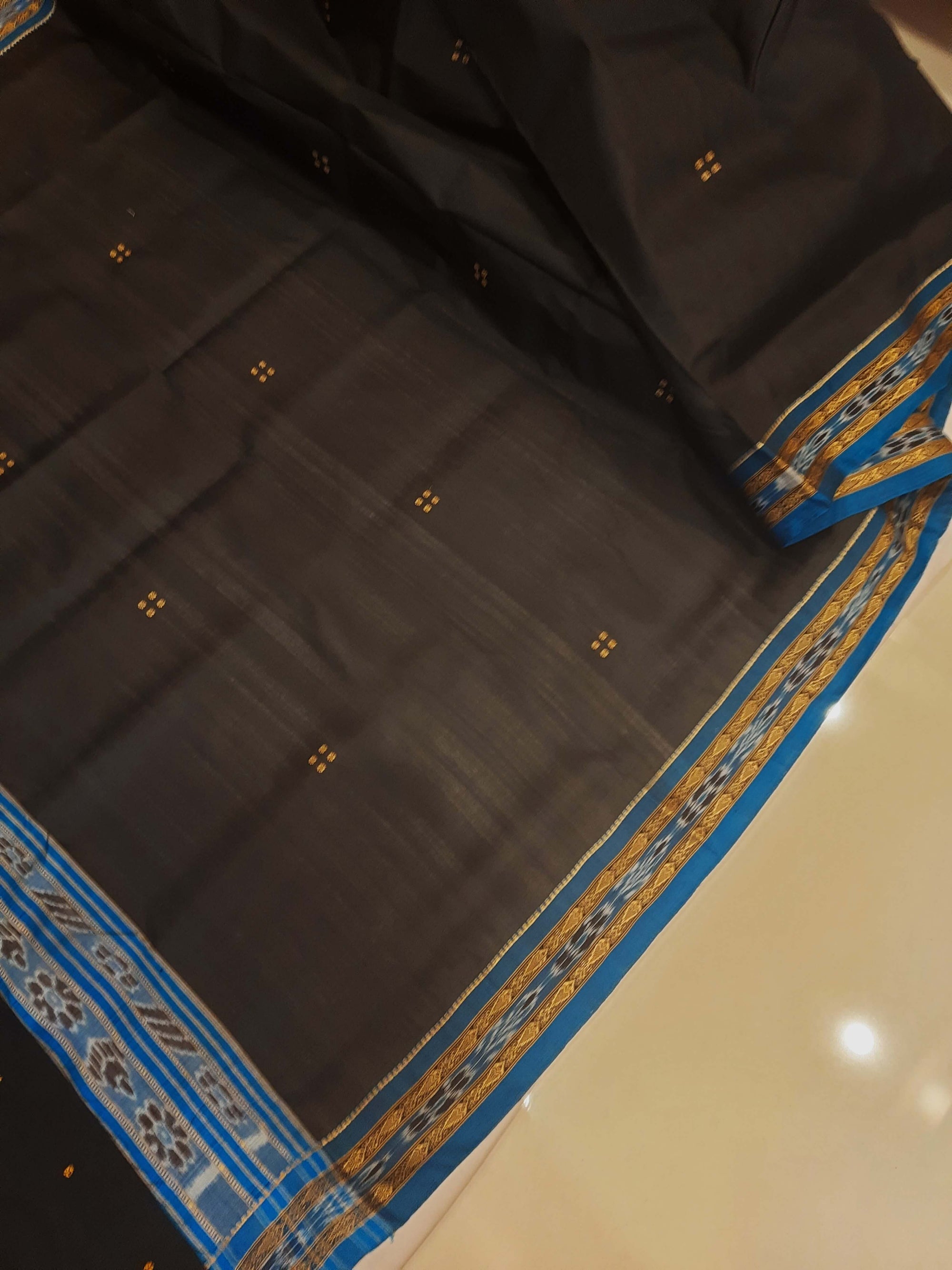 Black with Blue Fish motif Odisha Khandua Patta Silk Saree paired with cotton ikat blouse piece