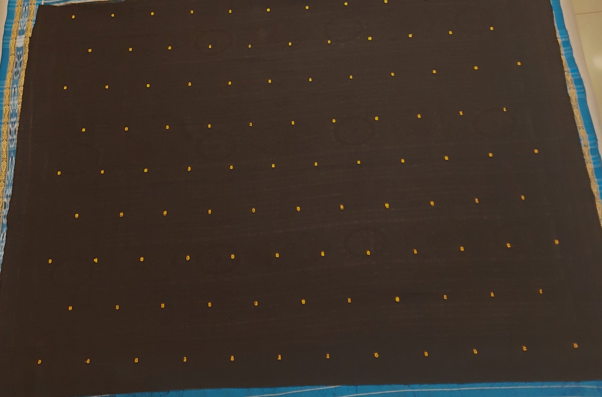 Black with Orange Odisha Khandua Patta Silk Saree paired with cotton ikat blouse piece