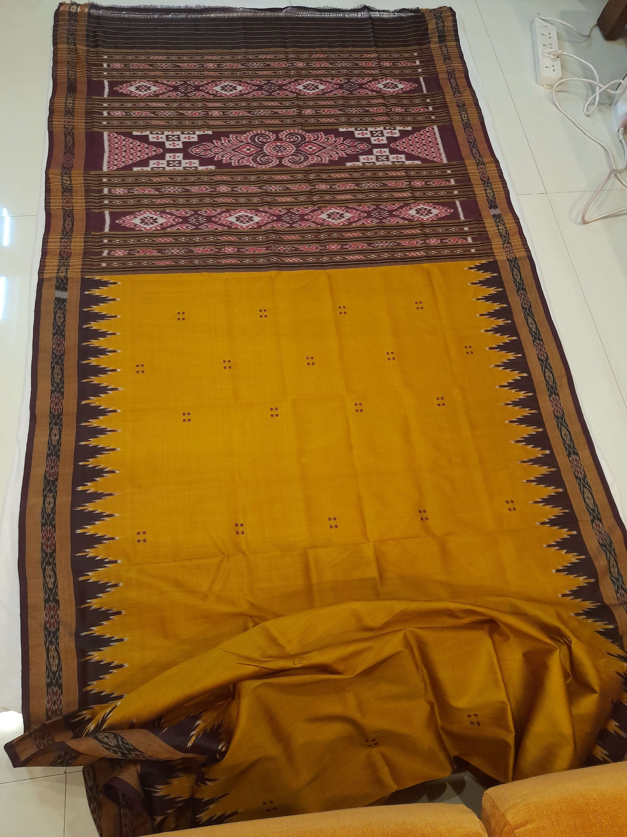 Golden Odisha Khandua Patta Silk Saree paired with cotton ikat blouse piece