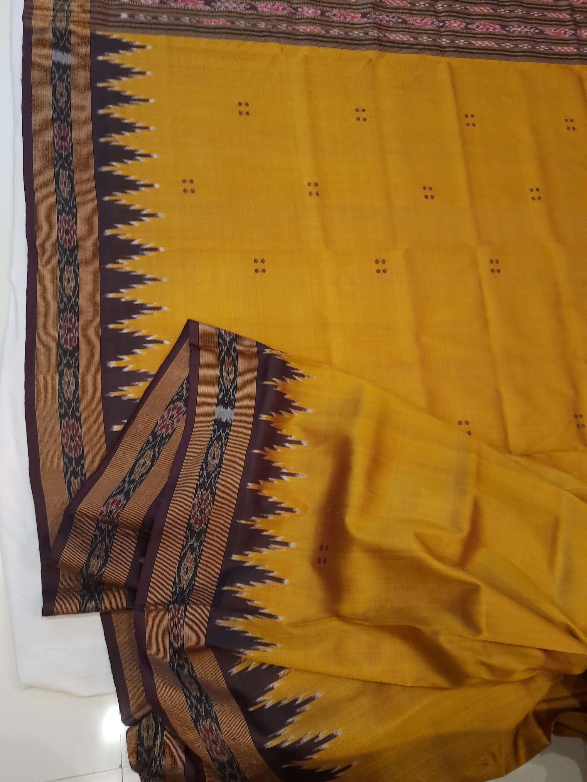 Golden Odisha Khandua Patta Silk Saree paired with cotton ikat blouse piece