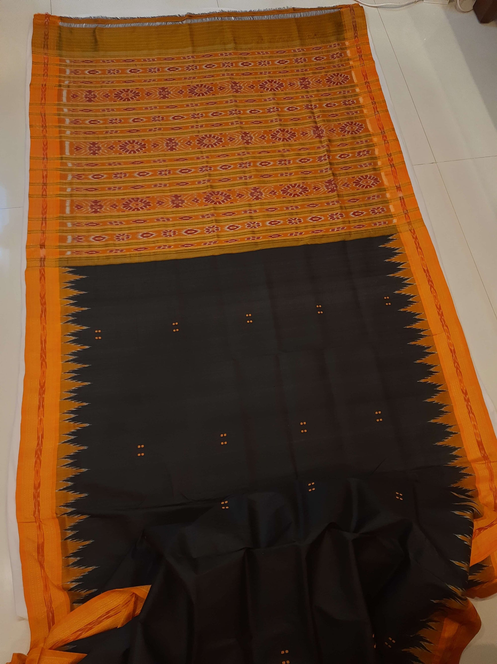 Black with Orange Odisha Khandua Patta Silk Saree paired with cotton ikat blouse piece