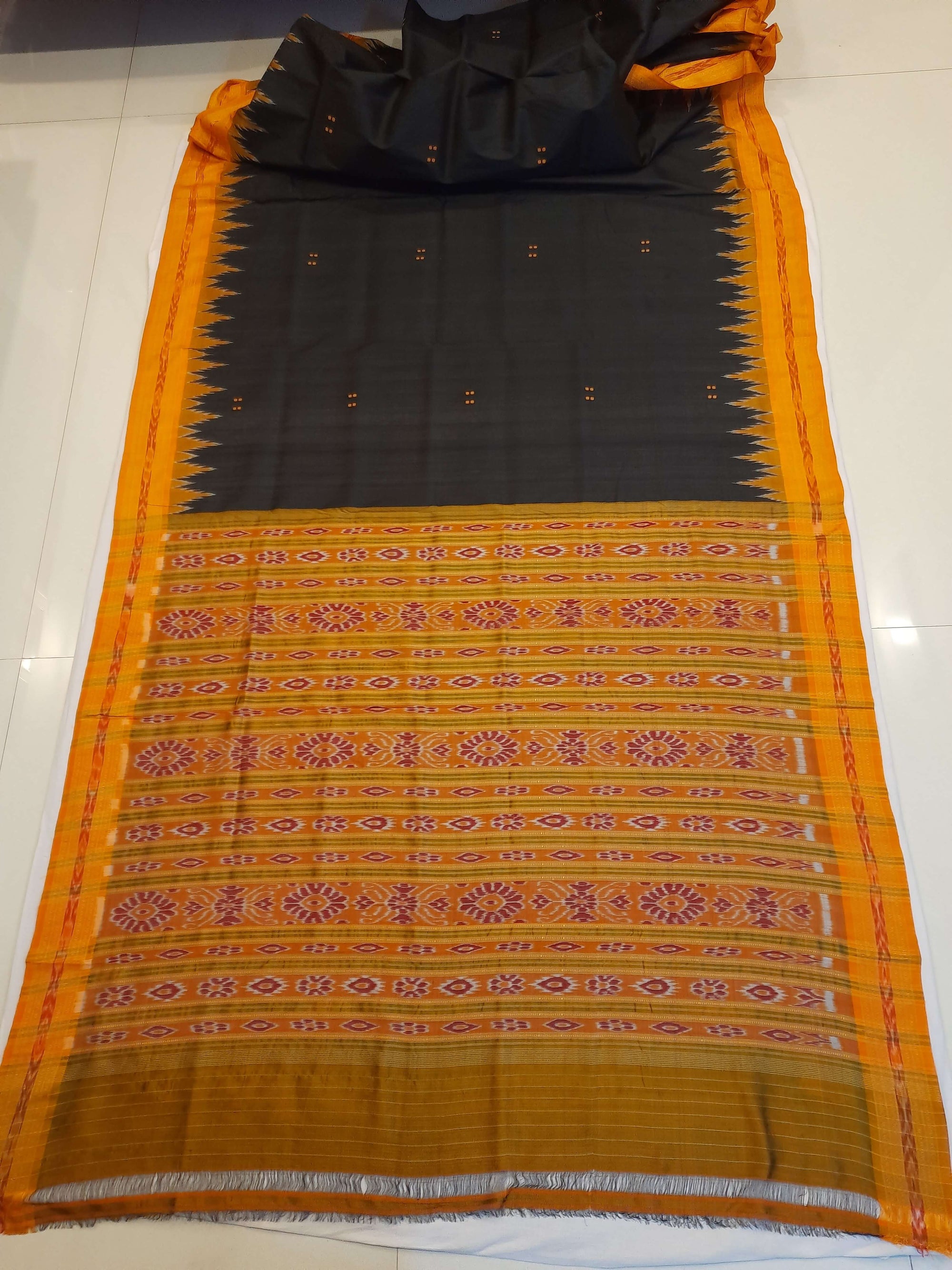 Black with Orange Odisha Khandua Patta Silk Saree paired with cotton ikat blouse piece
