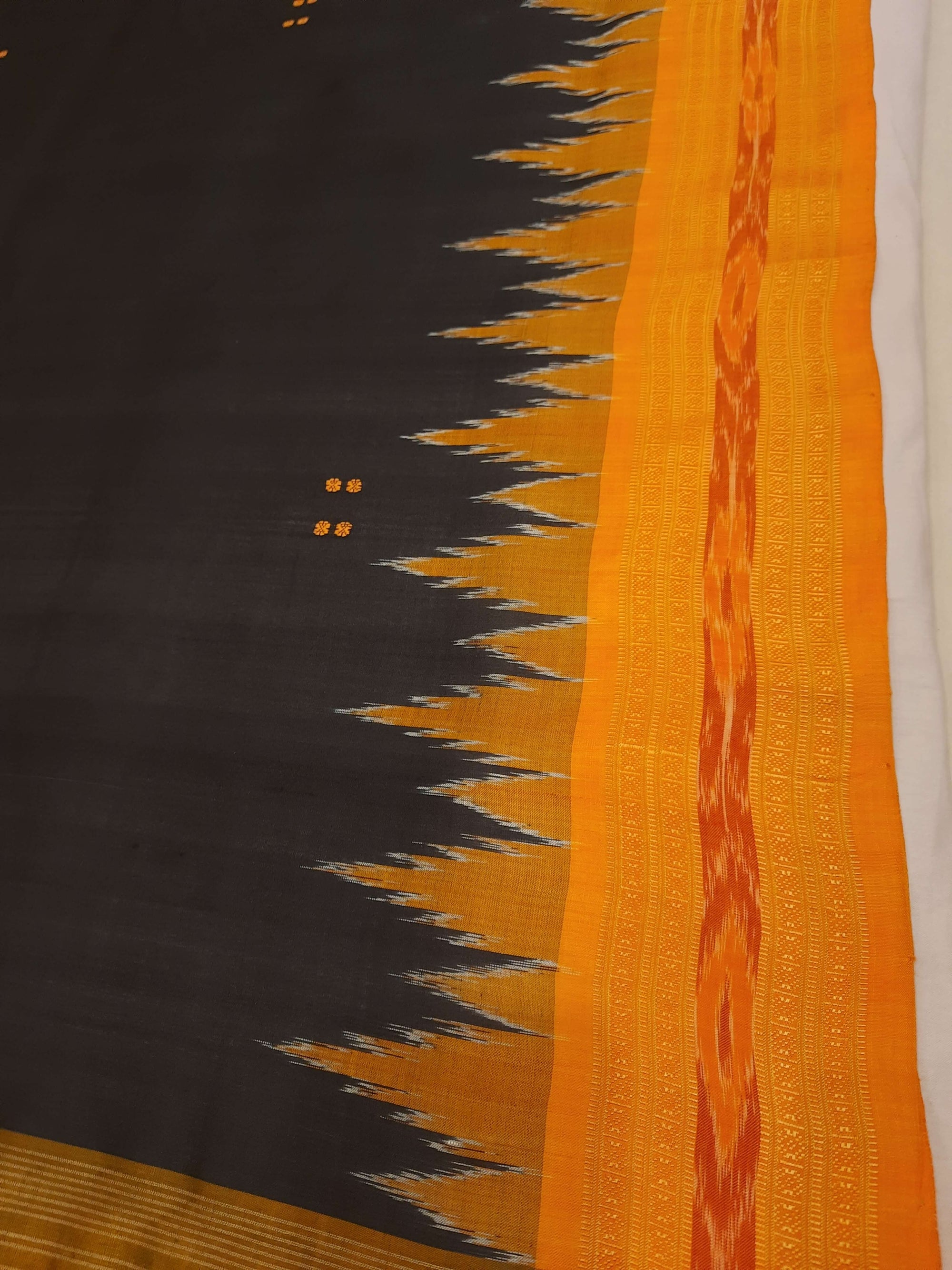 Black with Orange Odisha Khandua Patta Silk Saree paired with cotton ikat blouse piece