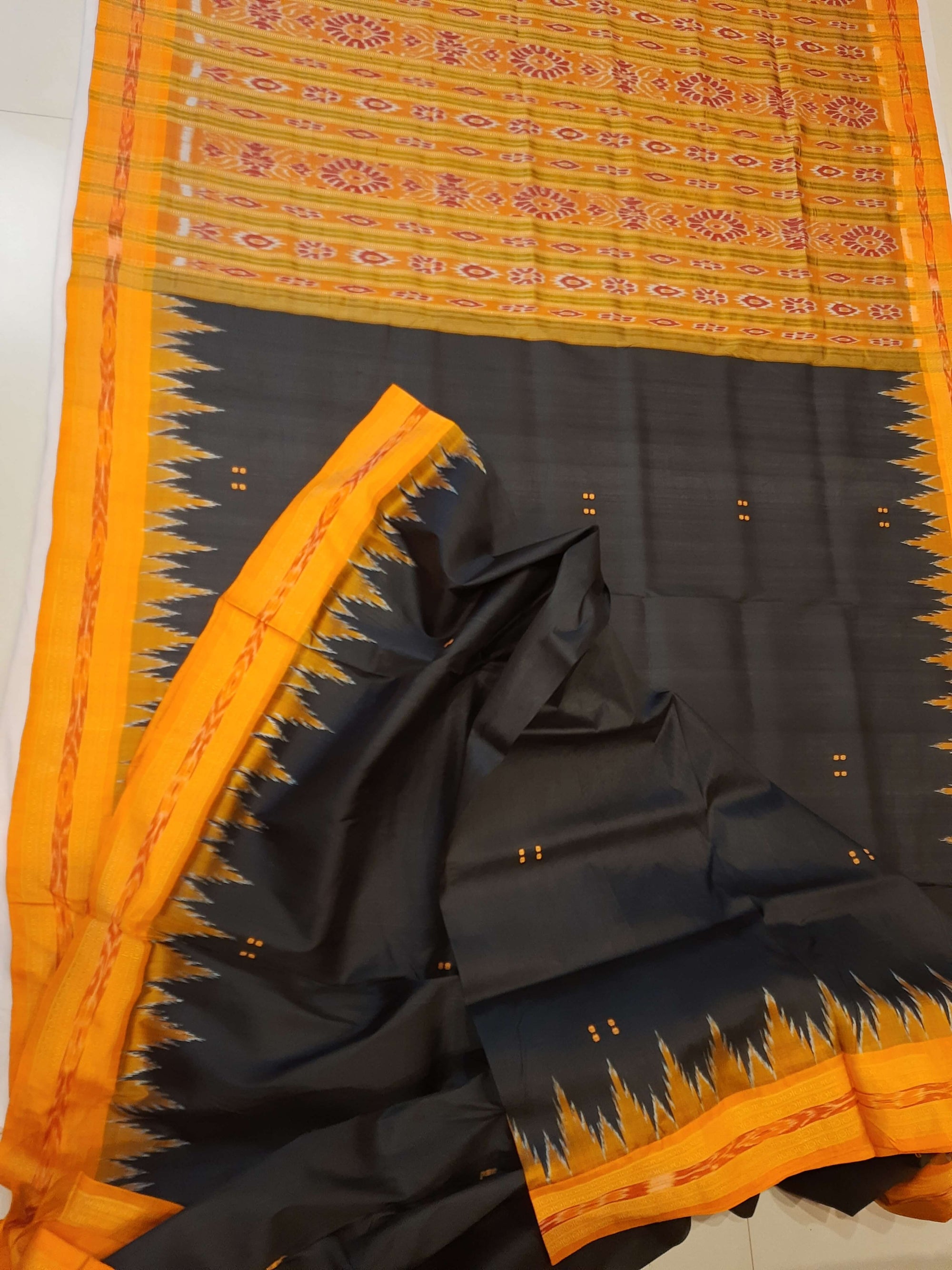 Black with Orange Odisha Khandua Patta Silk Saree paired with cotton ikat blouse piece