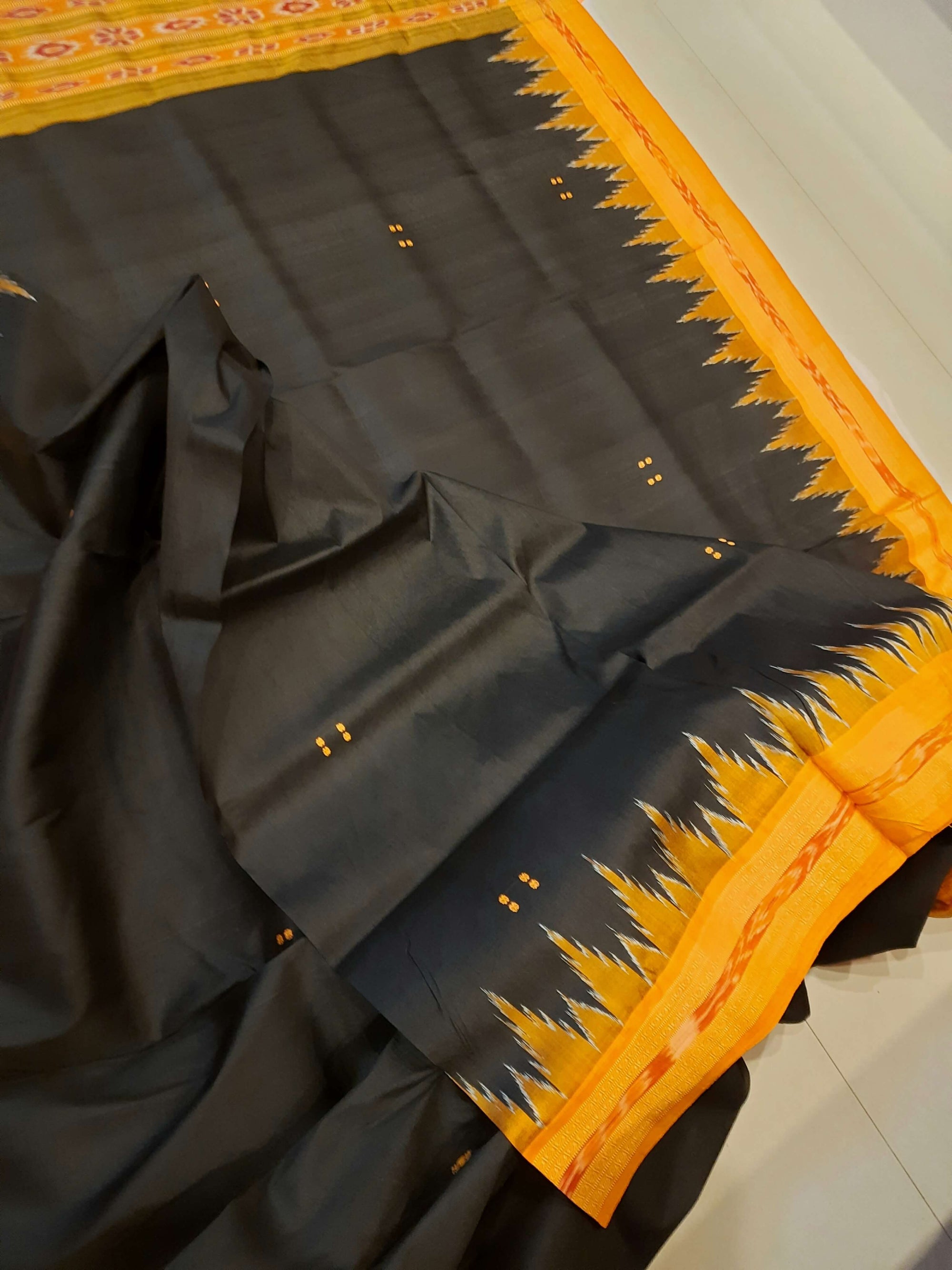 Black with Orange Odisha Khandua Patta Silk Saree paired with cotton ikat blouse piece