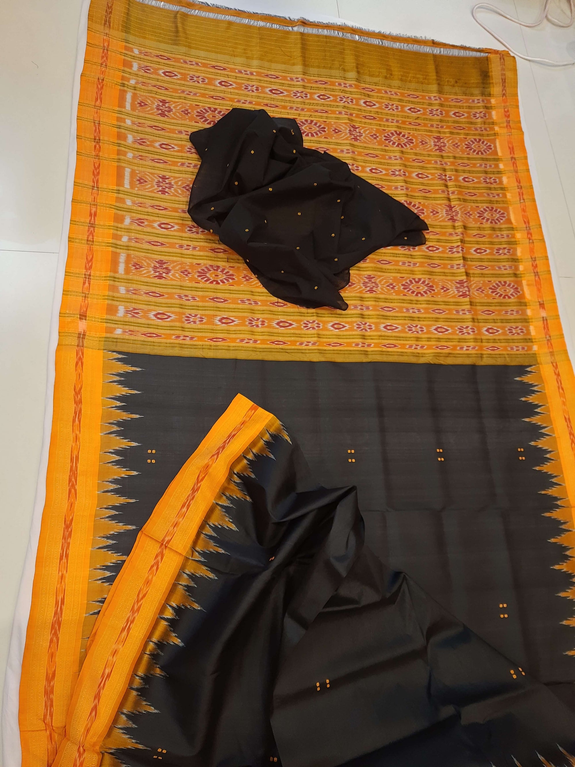 Black with Orange Odisha Khandua Patta Silk Saree paired with cotton ikat blouse piece