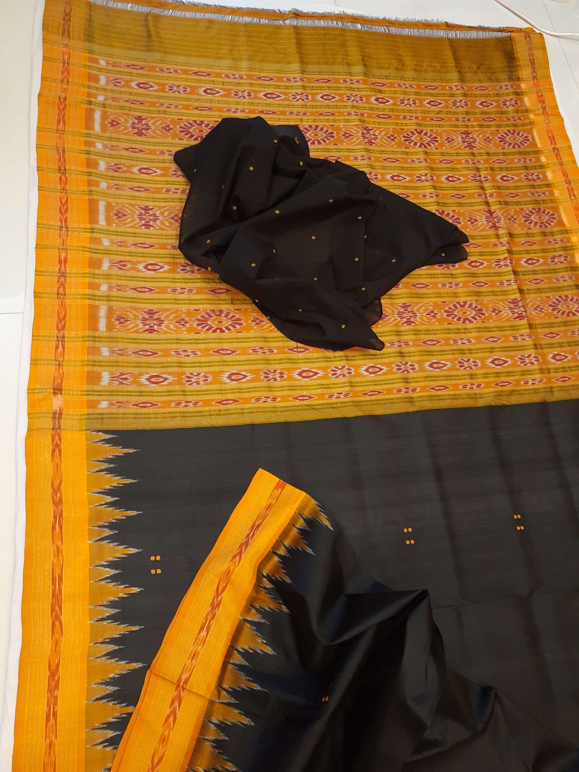 Black with Orange Odisha Khandua Patta Silk Saree paired with cotton ikat blouse piece