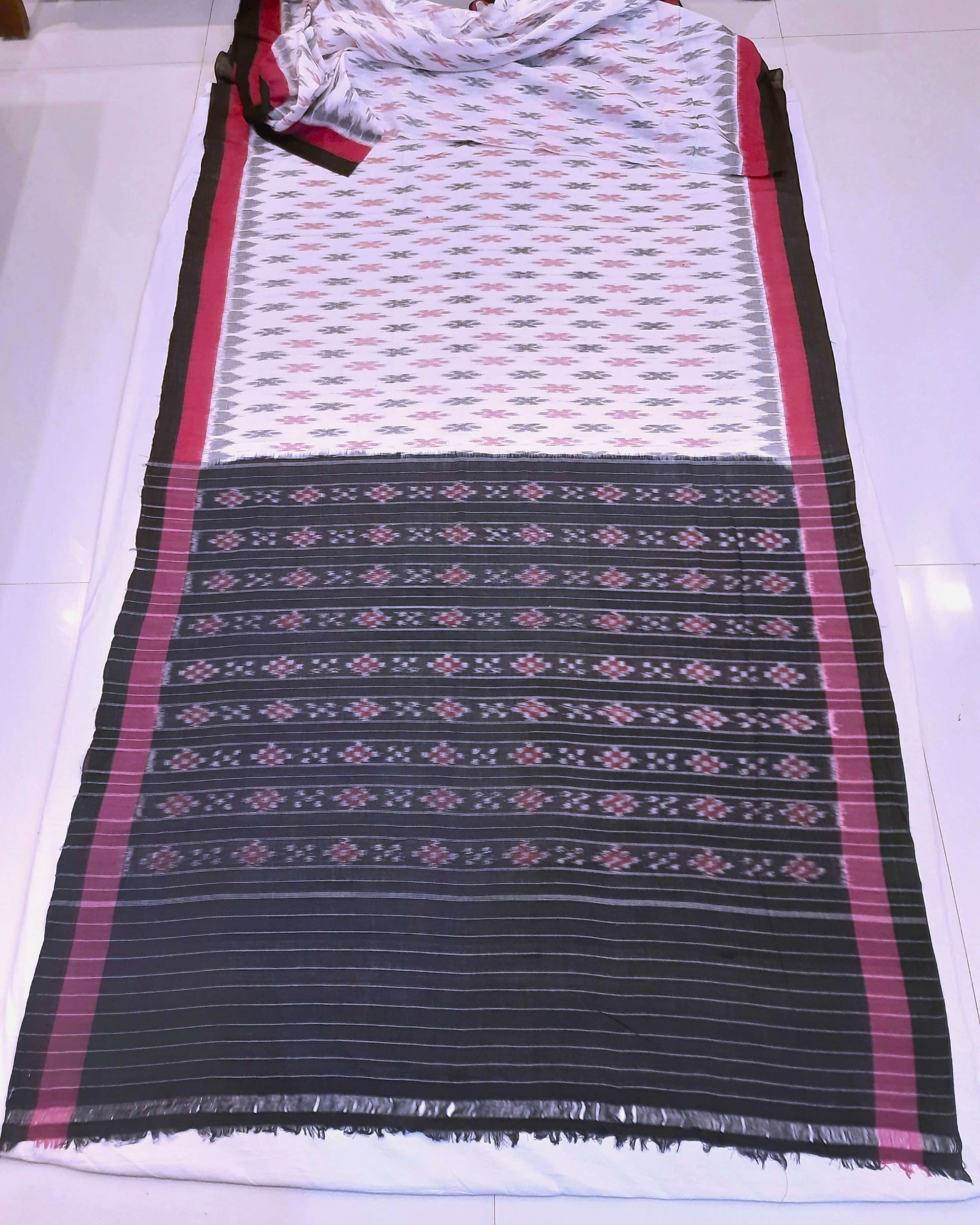 White with Pink and black Cotton Odisha Ikat saree with cotton ikat blouse piece