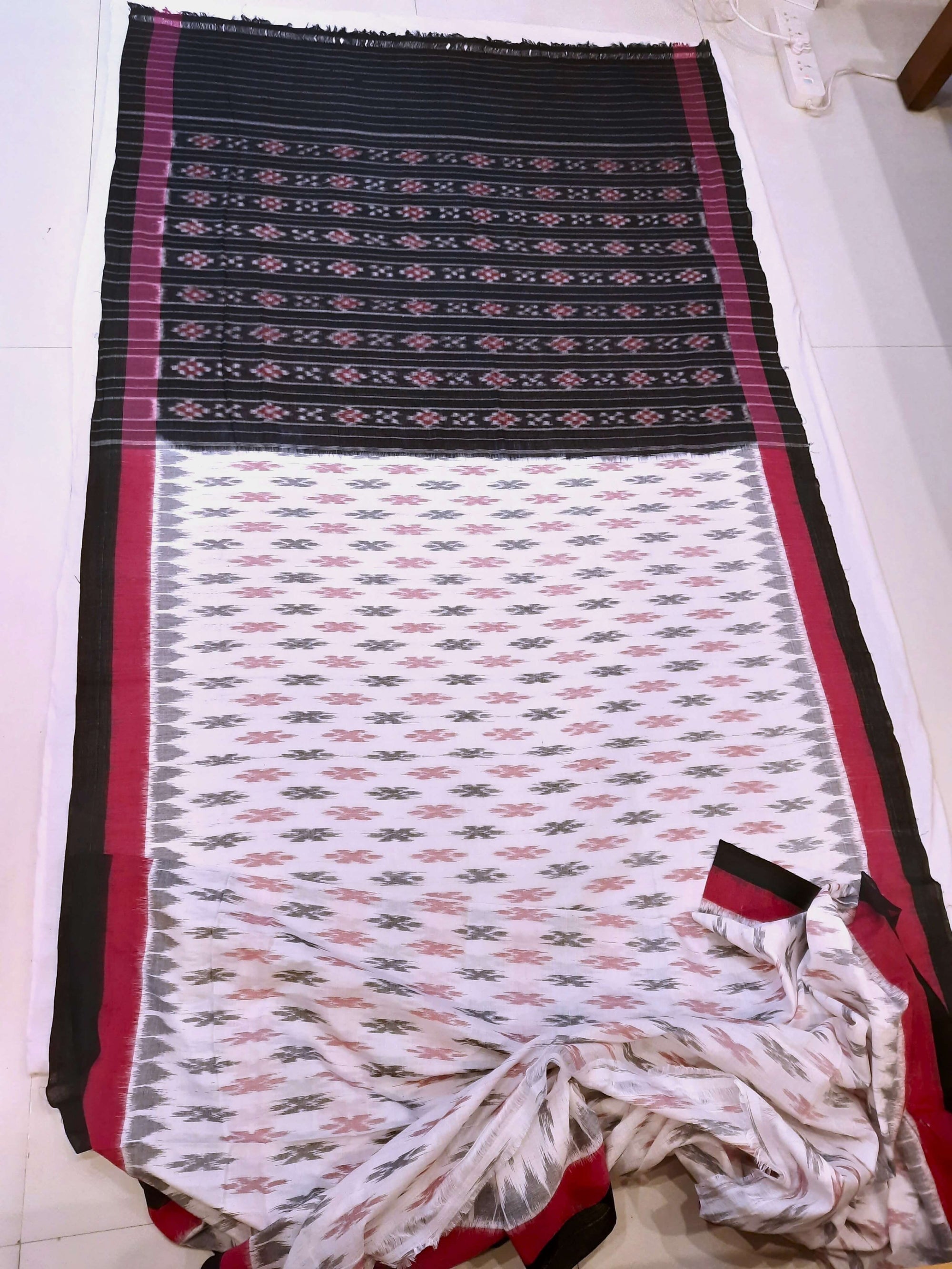 White with Pink and black Cotton Odisha Ikat saree with cotton ikat blouse piece