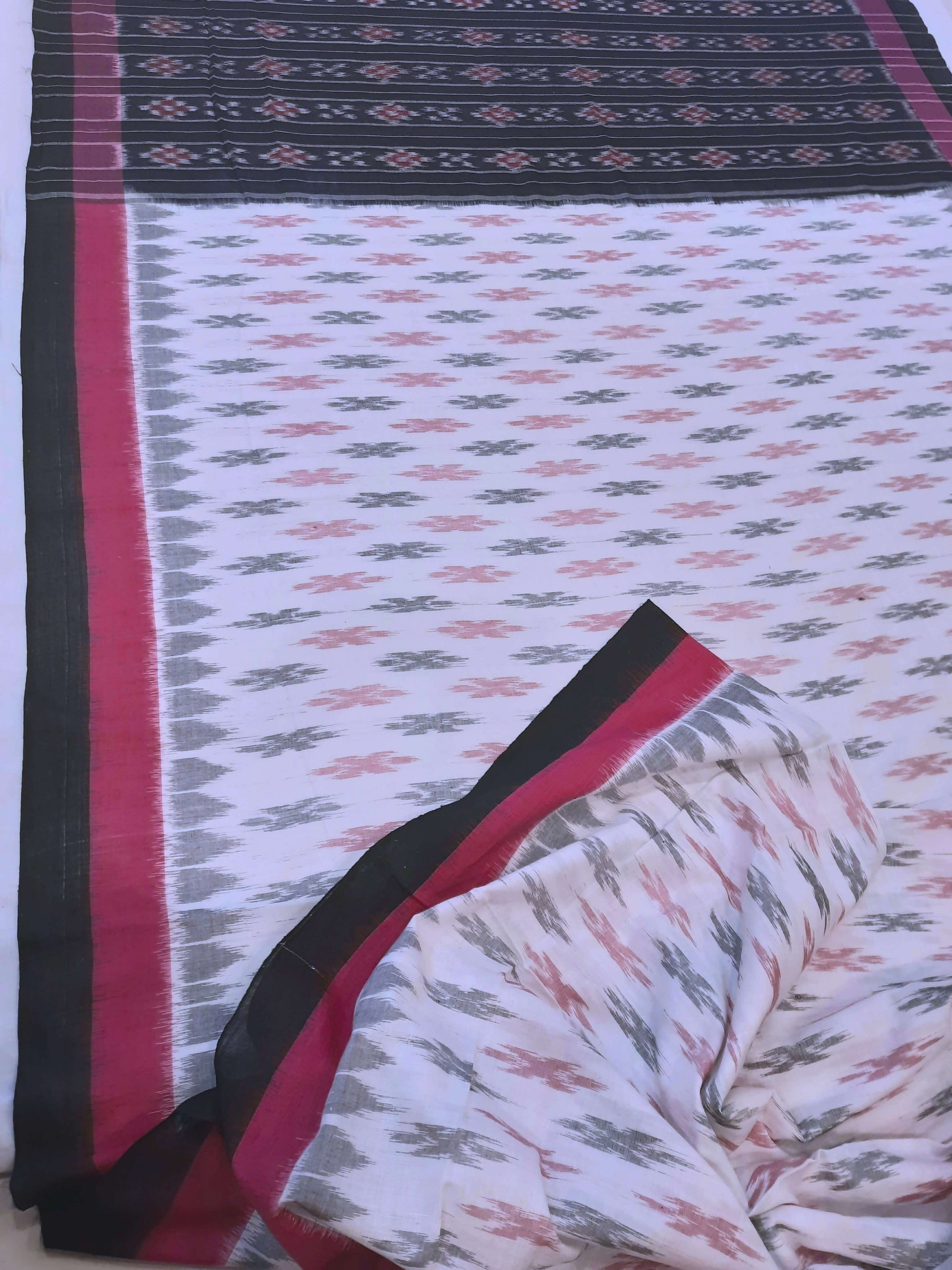 White with Pink and black Cotton Odisha Ikat saree with cotton ikat blouse piece