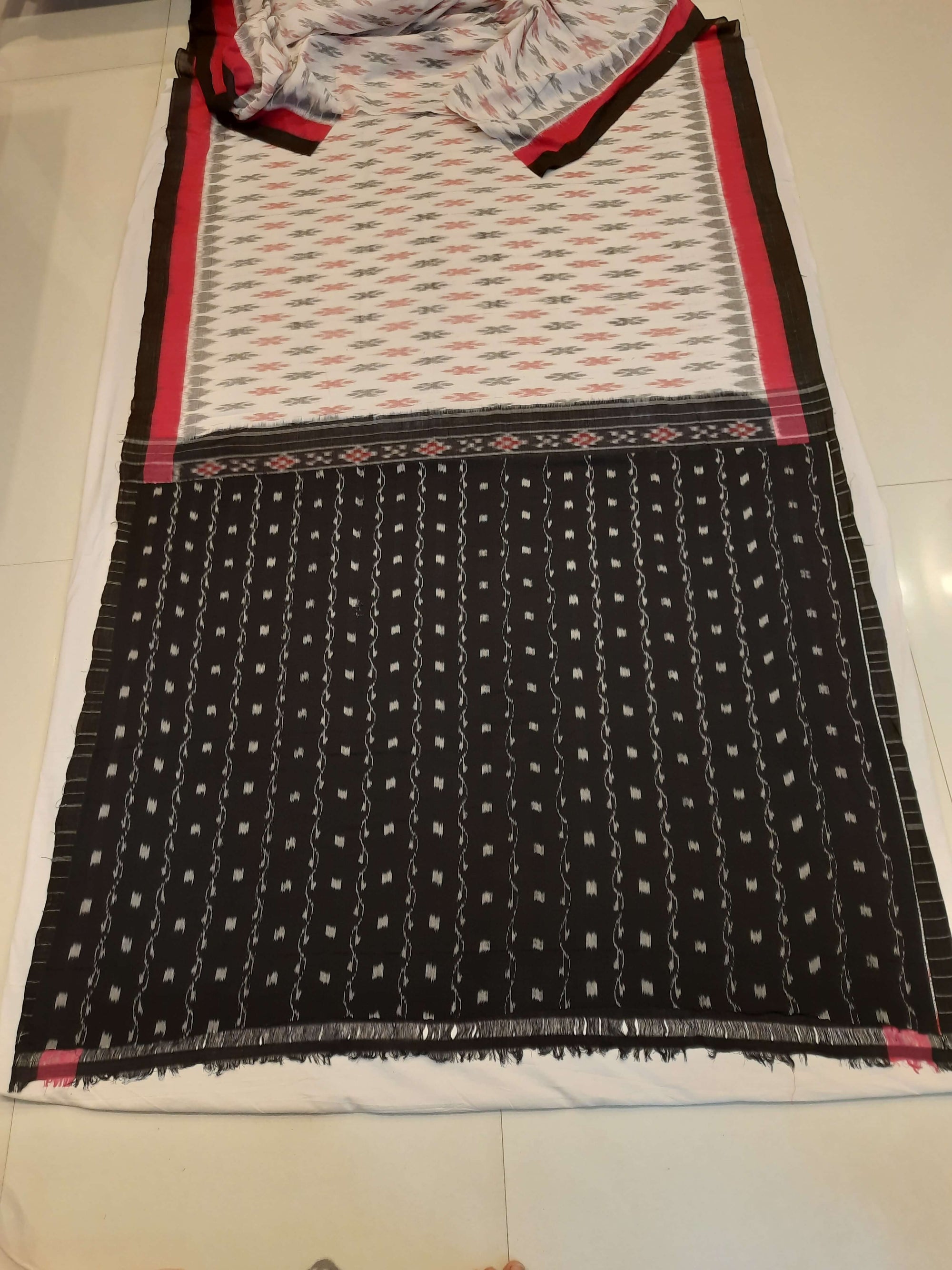 White with Pink and black Cotton Odisha Ikat saree with cotton ikat blouse piece