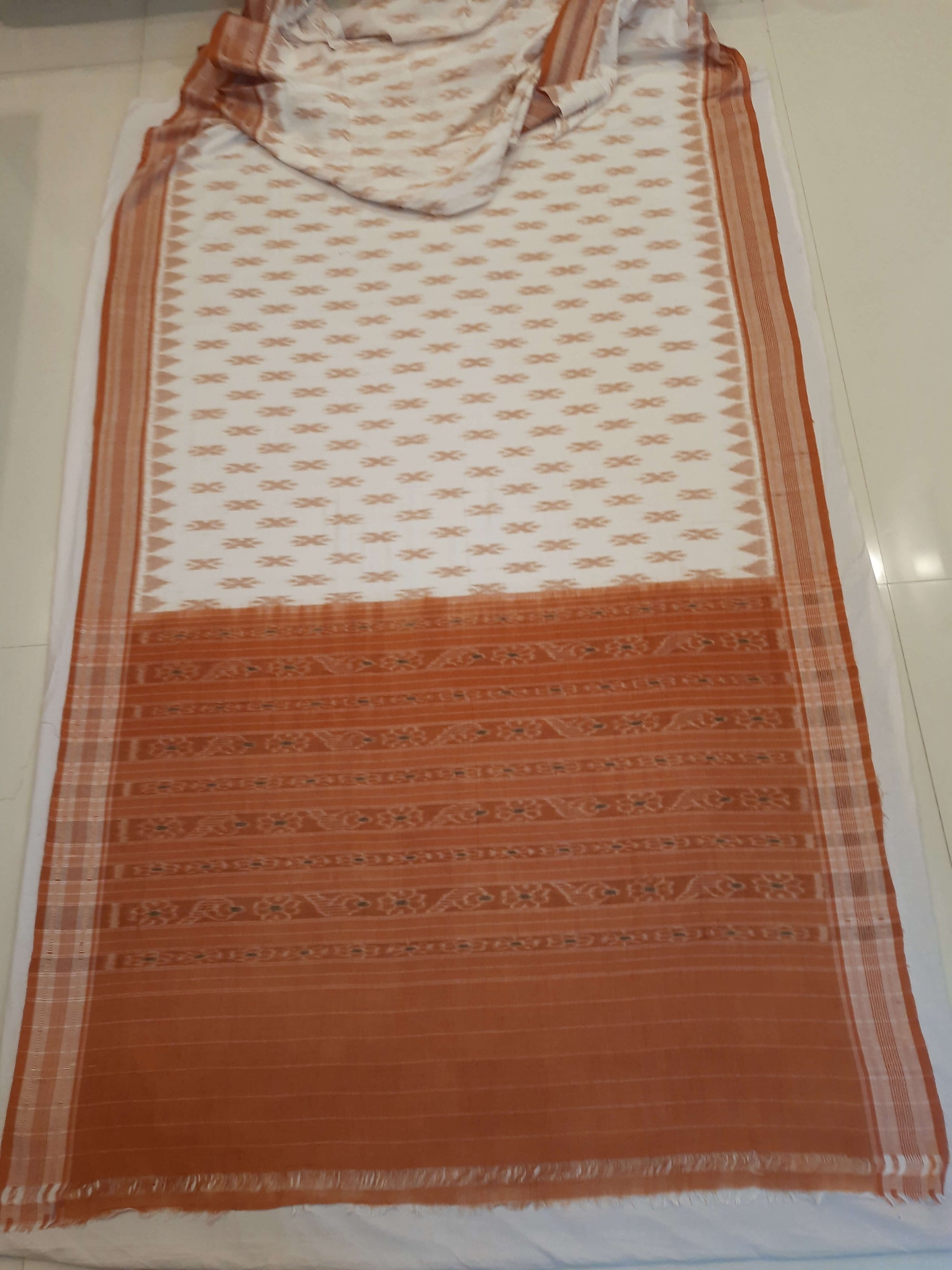 Off-white Cotton Odisha Ikat saree with cotton ikat blouse piece