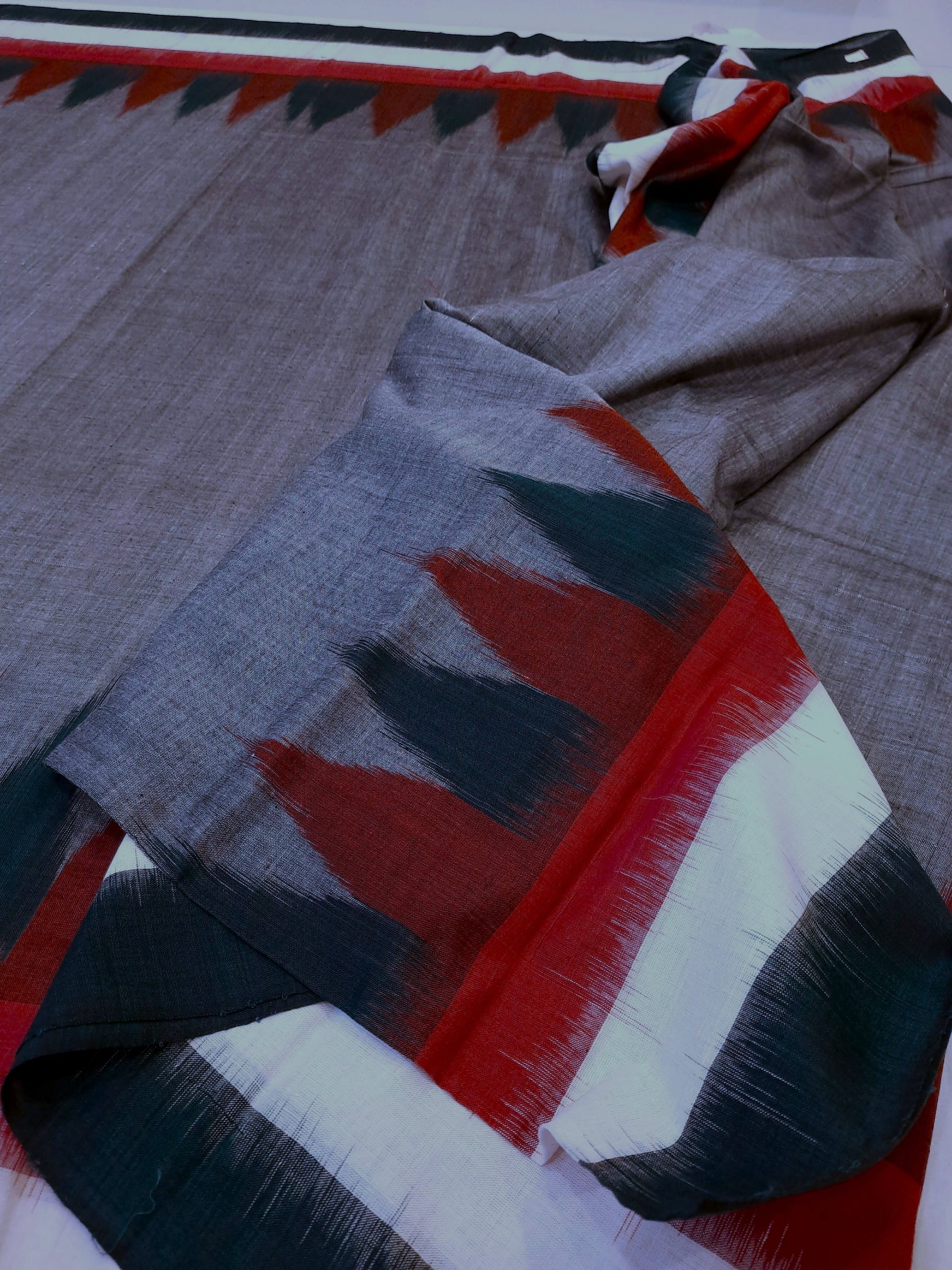 Grey double border Cotton Odisha Ikat saree with cotton ikat blouse piece