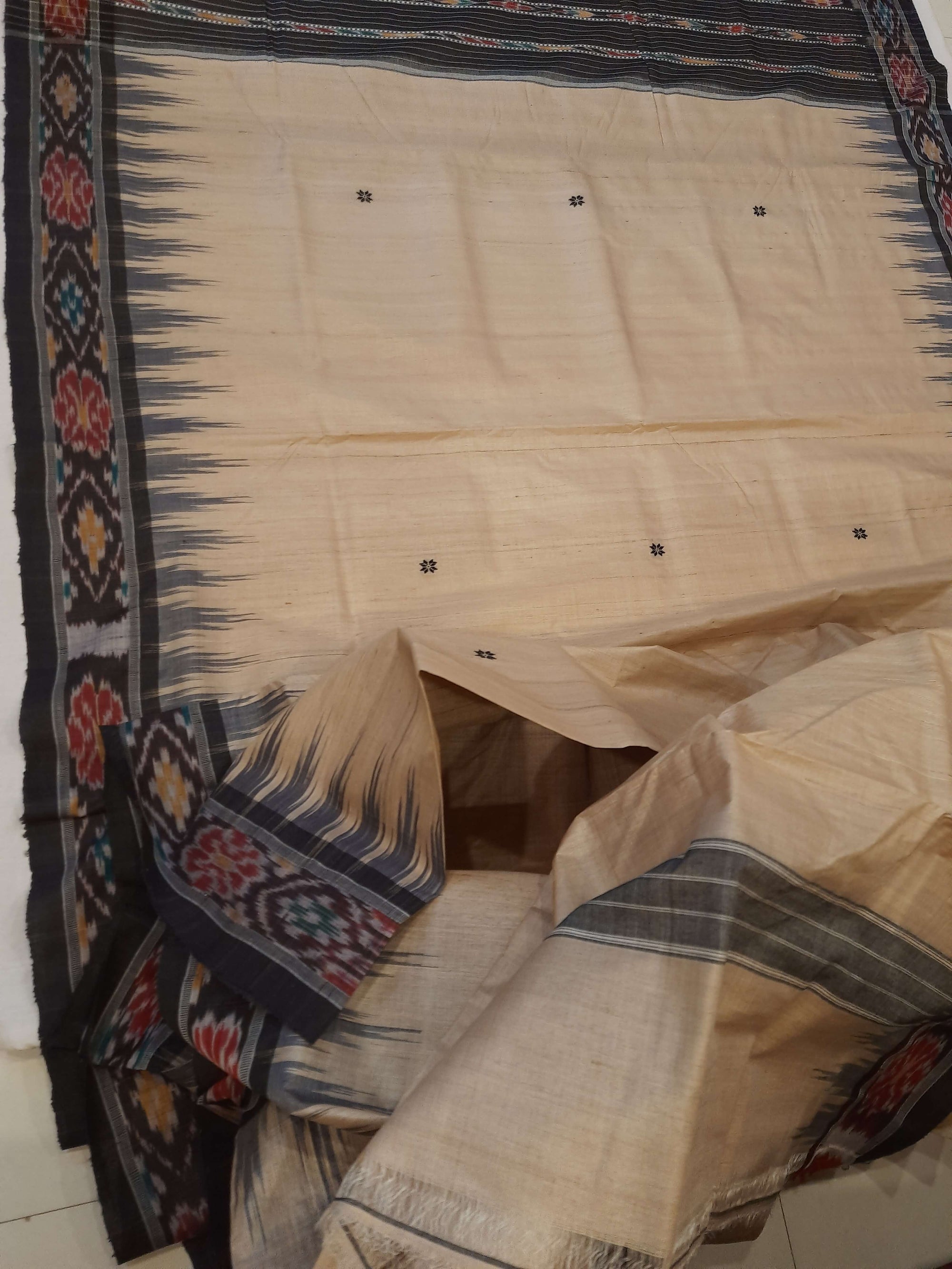 Beige with Black Tussar Silk Odisha Ikat Saree paired with cotton ikat blouse piece