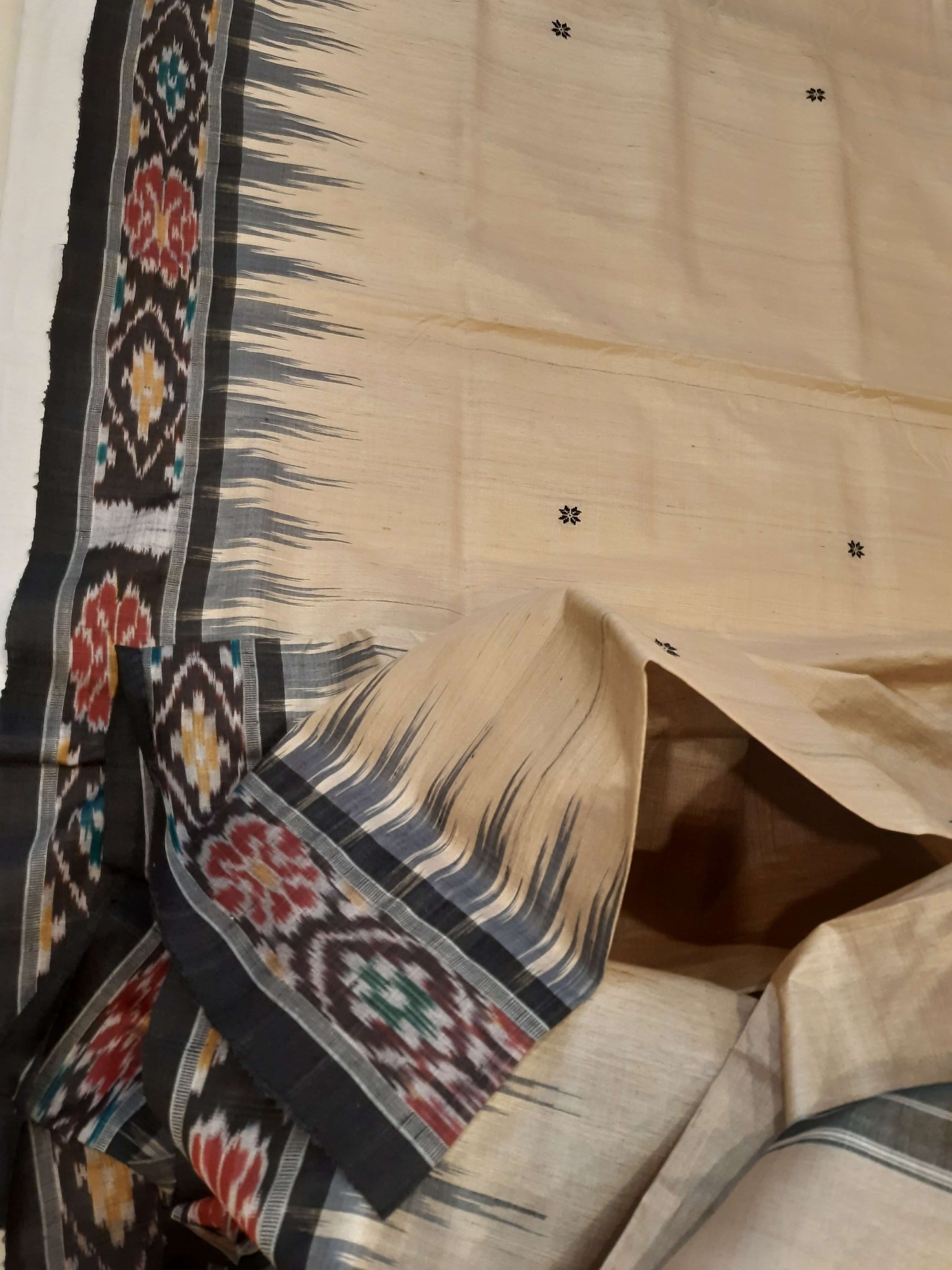 Beige with Black Tussar Silk Odisha Ikat Saree paired with cotton ikat blouse piece
