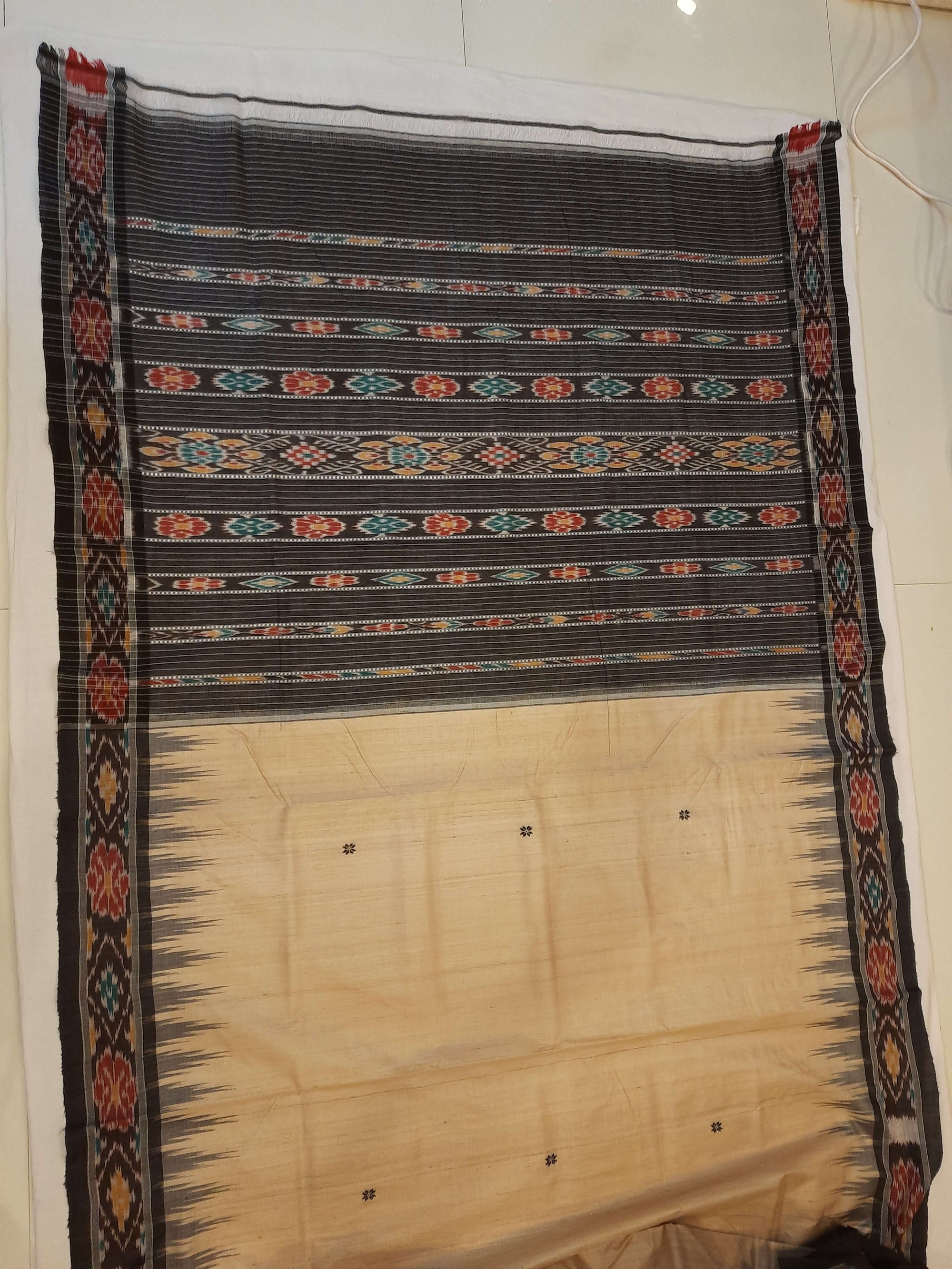Beige with Black Tussar Silk Odisha Ikat Saree paired with cotton ikat blouse piece