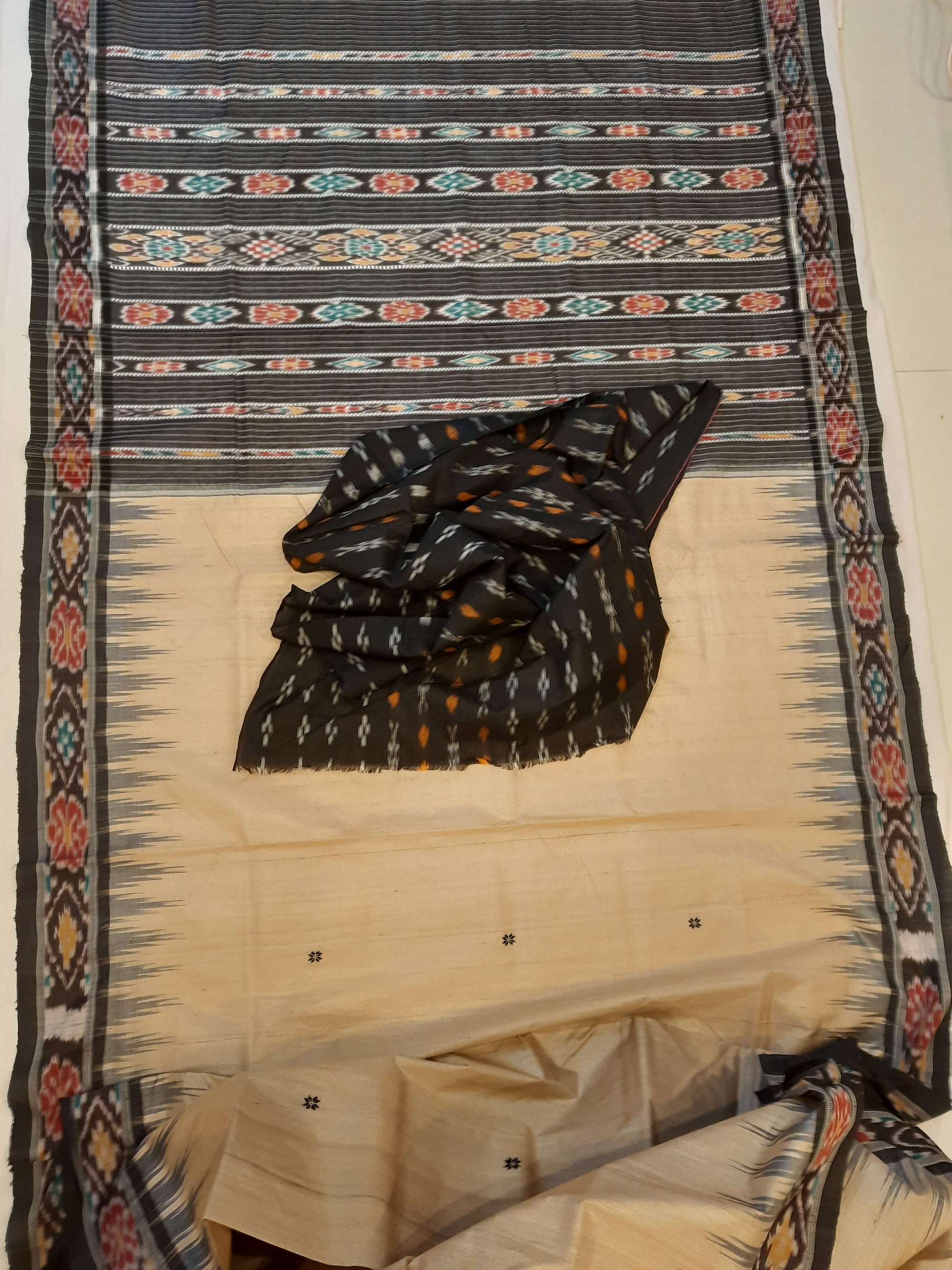 Beige with Black Tussar Silk Odisha Ikat Saree paired with cotton ikat blouse piece