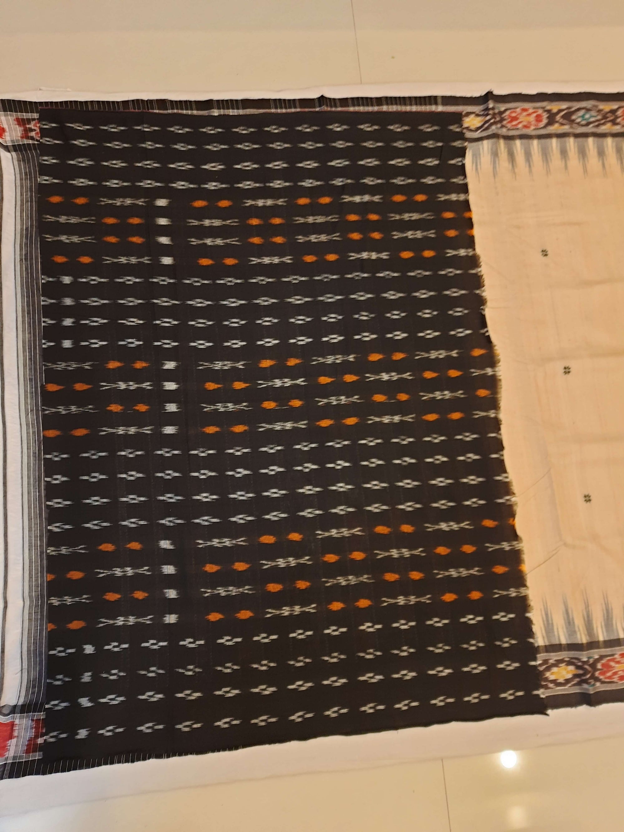 Beige with Black Tussar Silk Odisha Ikat Saree paired with cotton ikat blouse piece