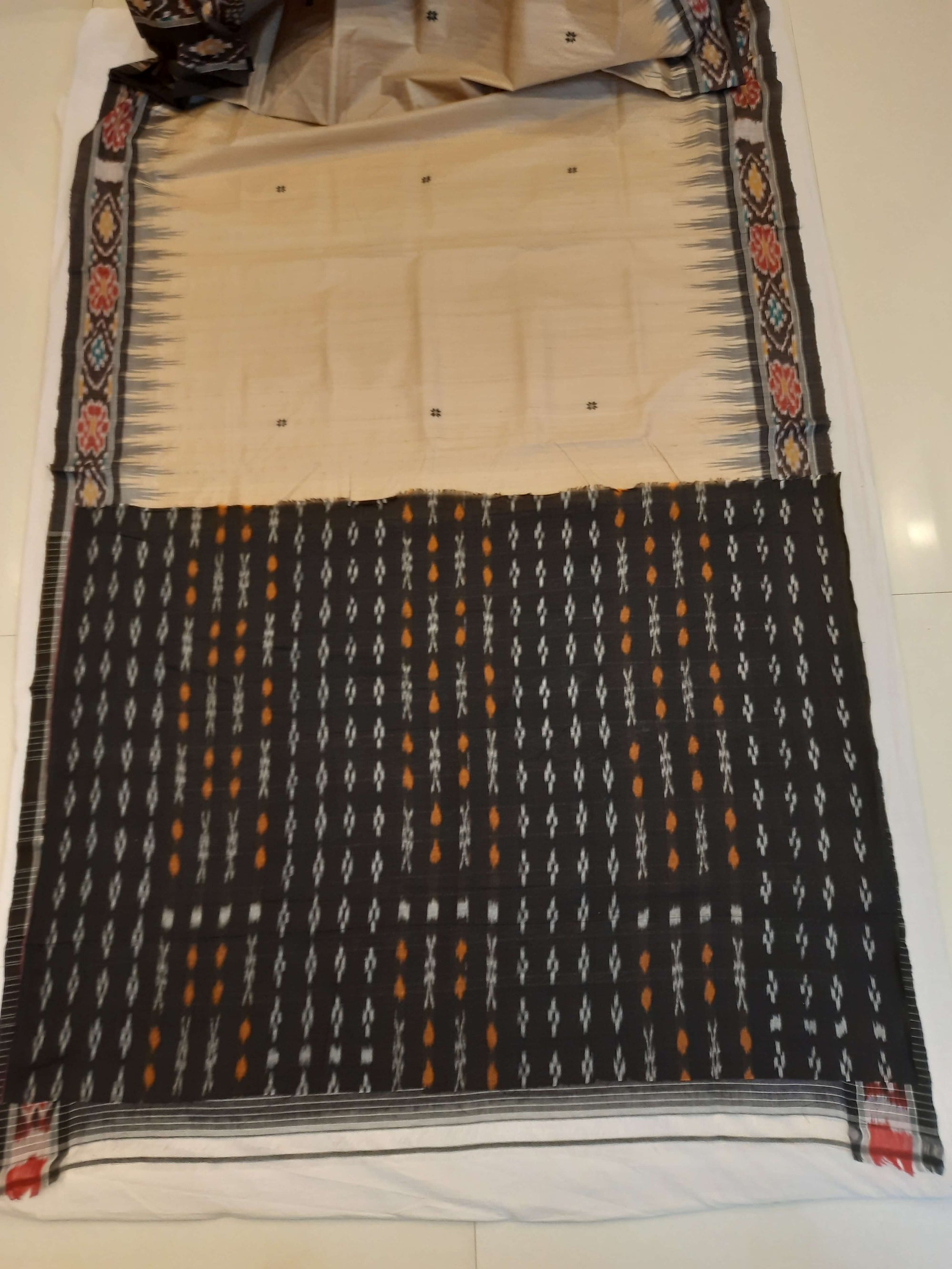 Beige with Black Tussar Silk Odisha Ikat Saree paired with cotton ikat blouse piece