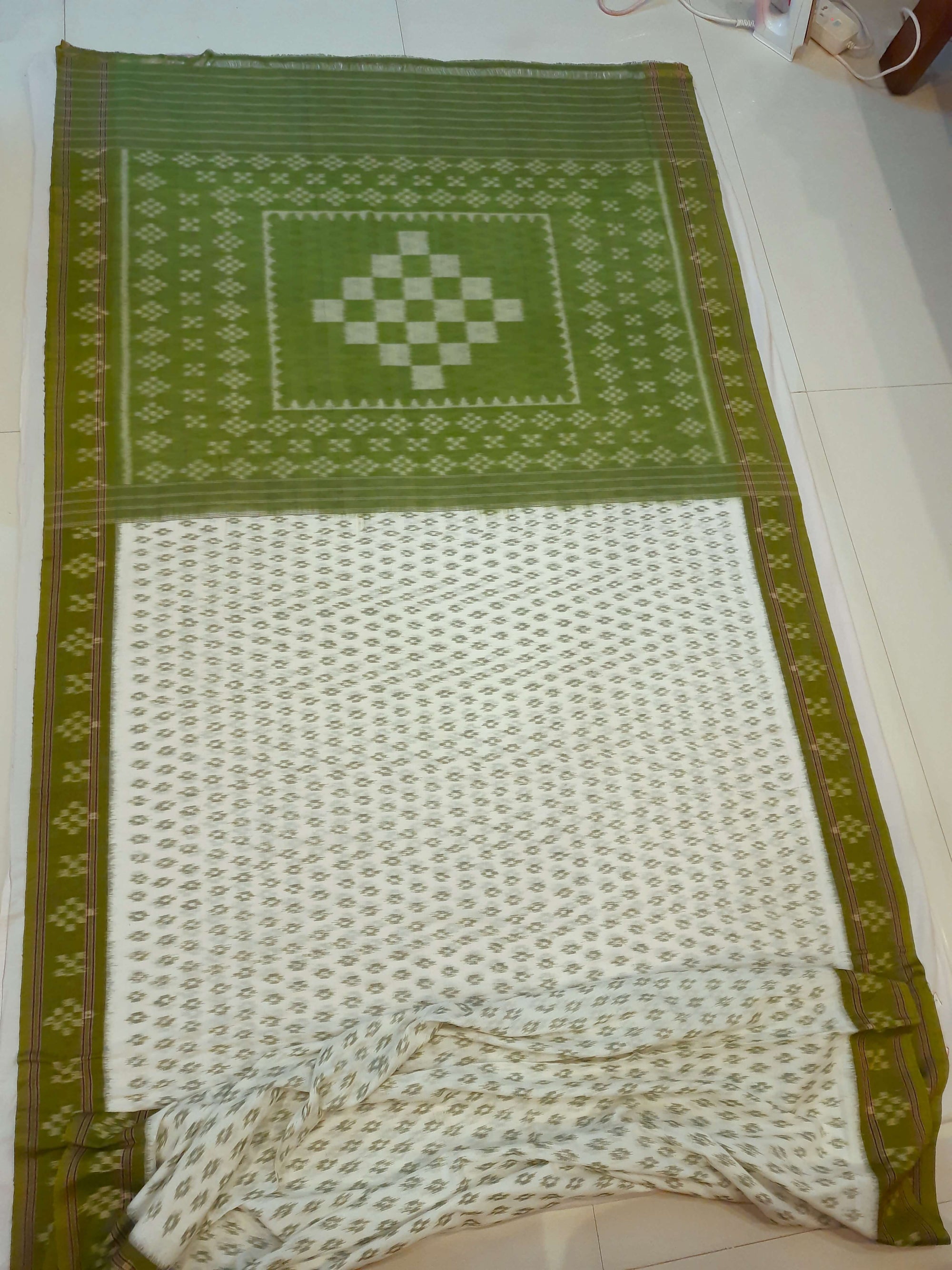 White with Mehendi Green Cotton Odisha Ikat saree with cotton ikat blouse piece