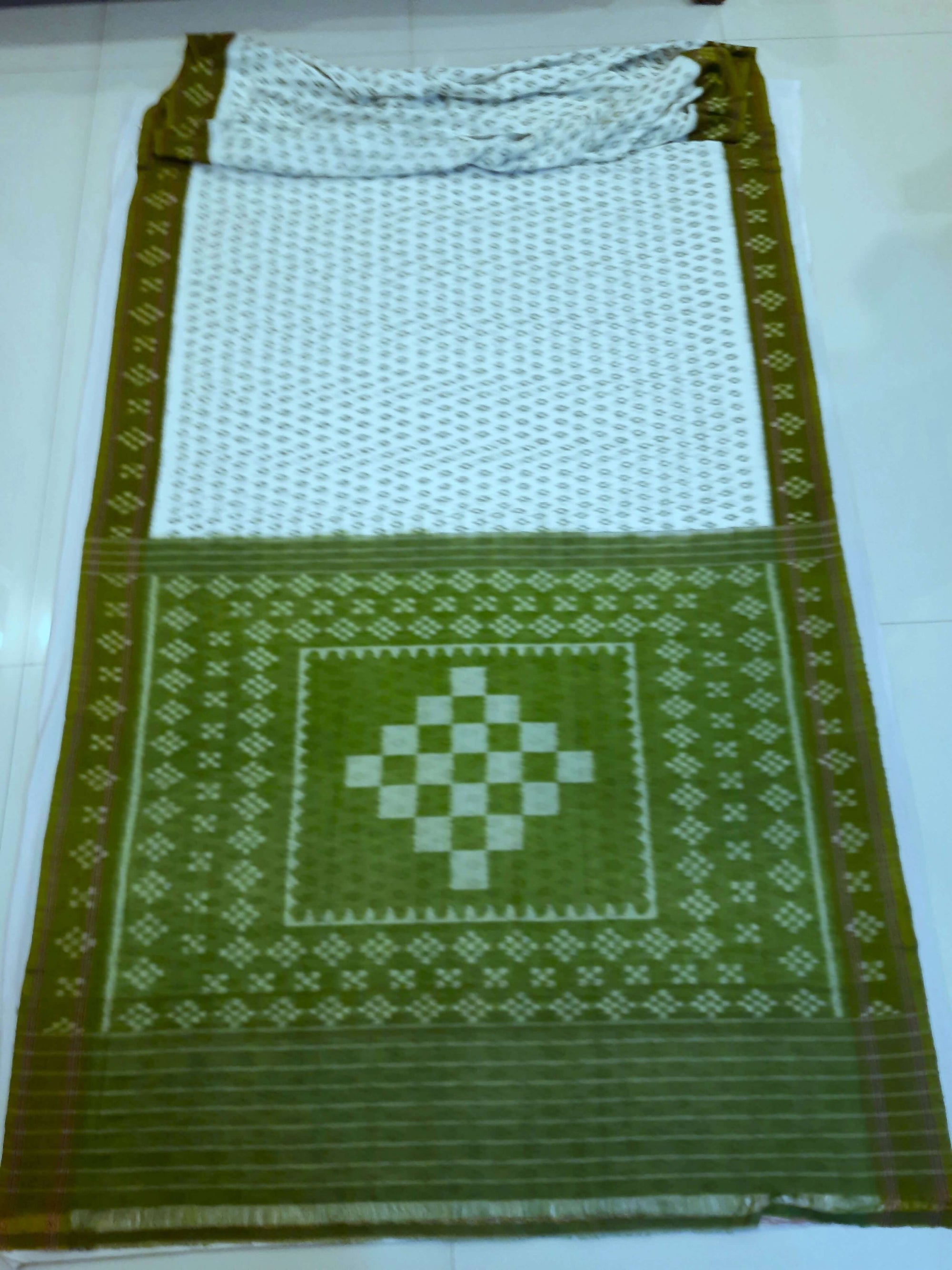 White with Mehendi Green Cotton Odisha Ikat saree with cotton ikat blouse piece