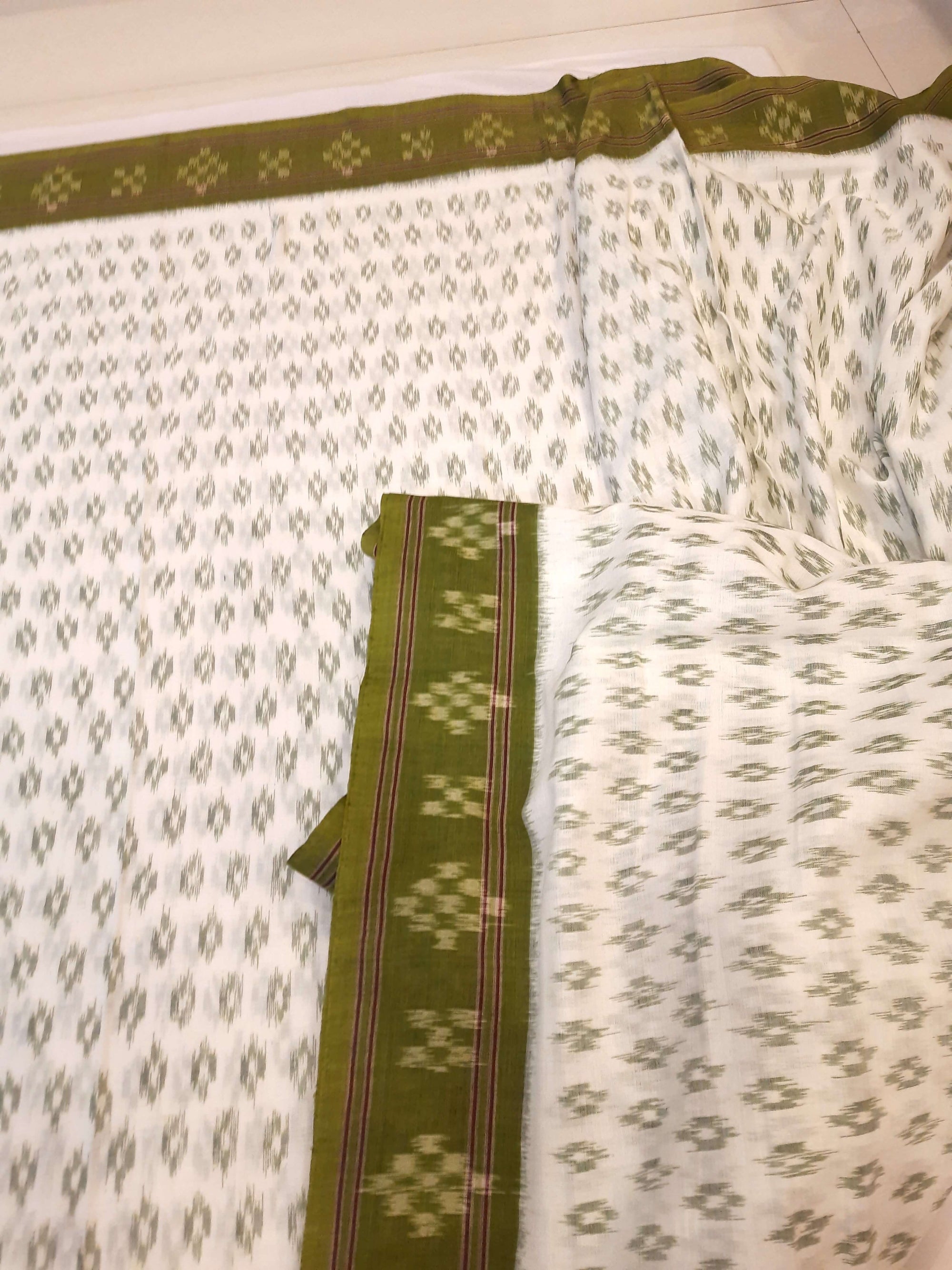 White with Mehendi Green Cotton Odisha Ikat saree with cotton ikat blouse piece
