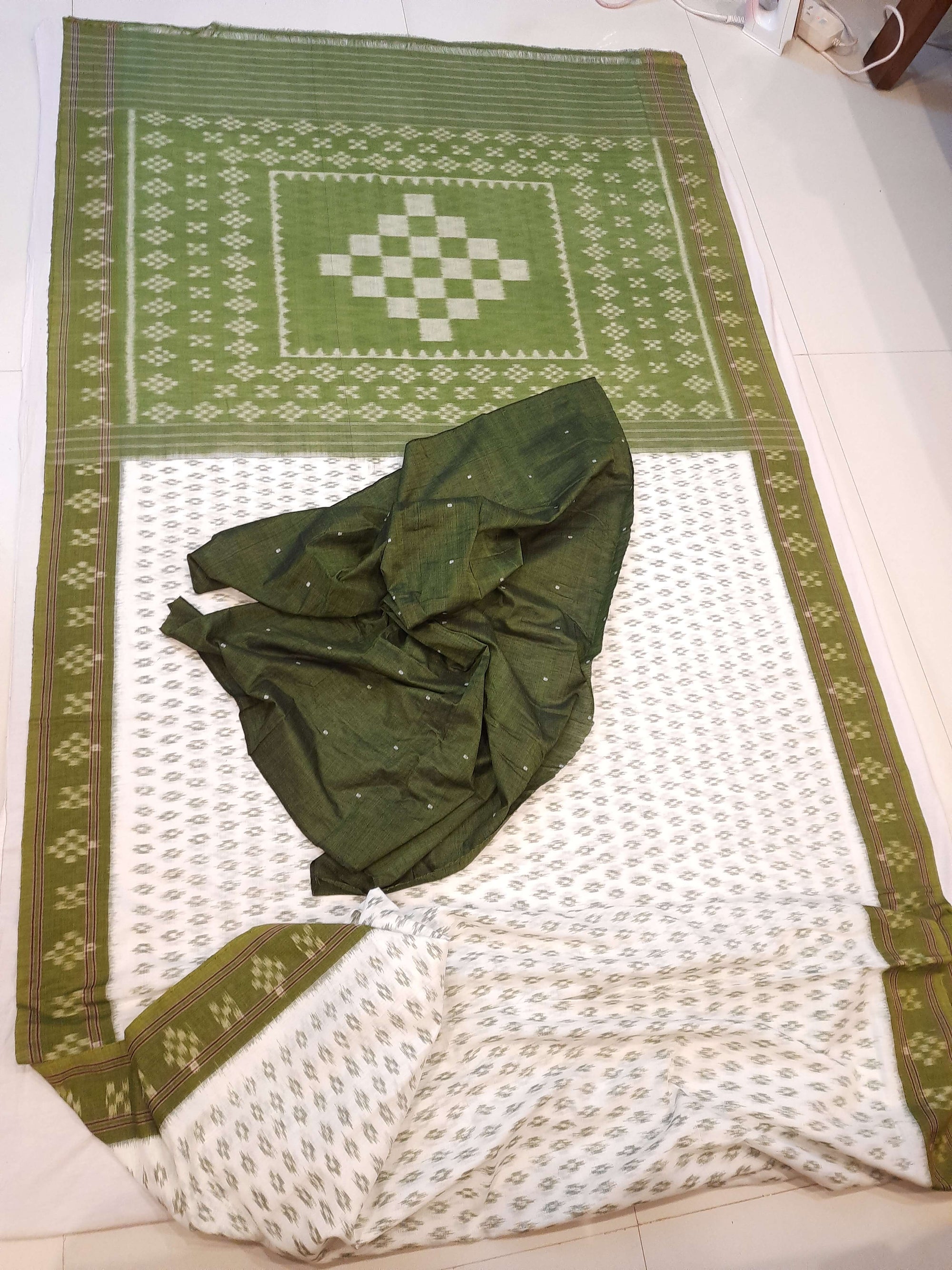 White with Mehendi Green Cotton Odisha Ikat saree with cotton ikat blouse piece