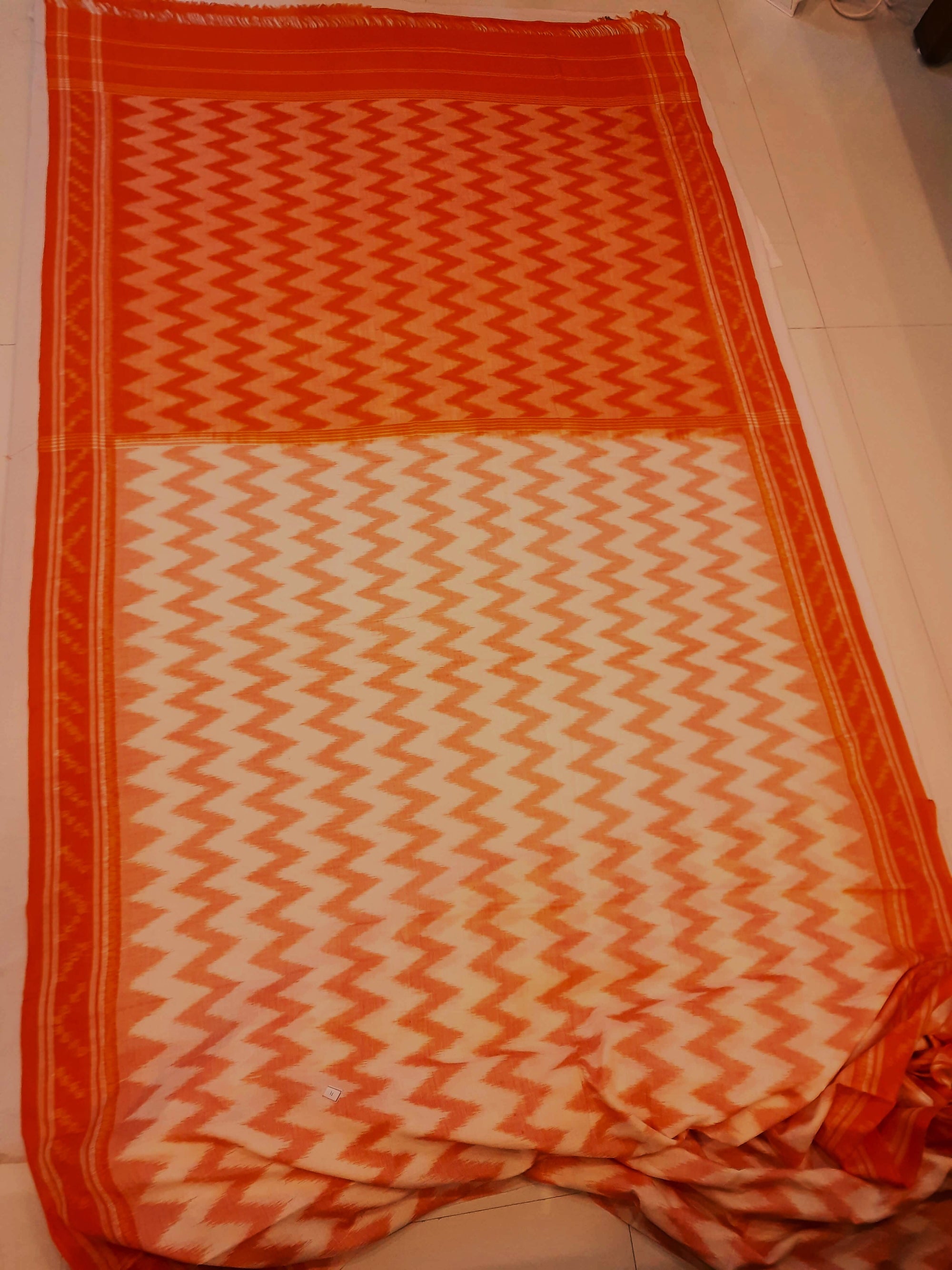 Off-white with Orange Cotton Odisha Ikat saree with mix match cotton ikat blouse piece