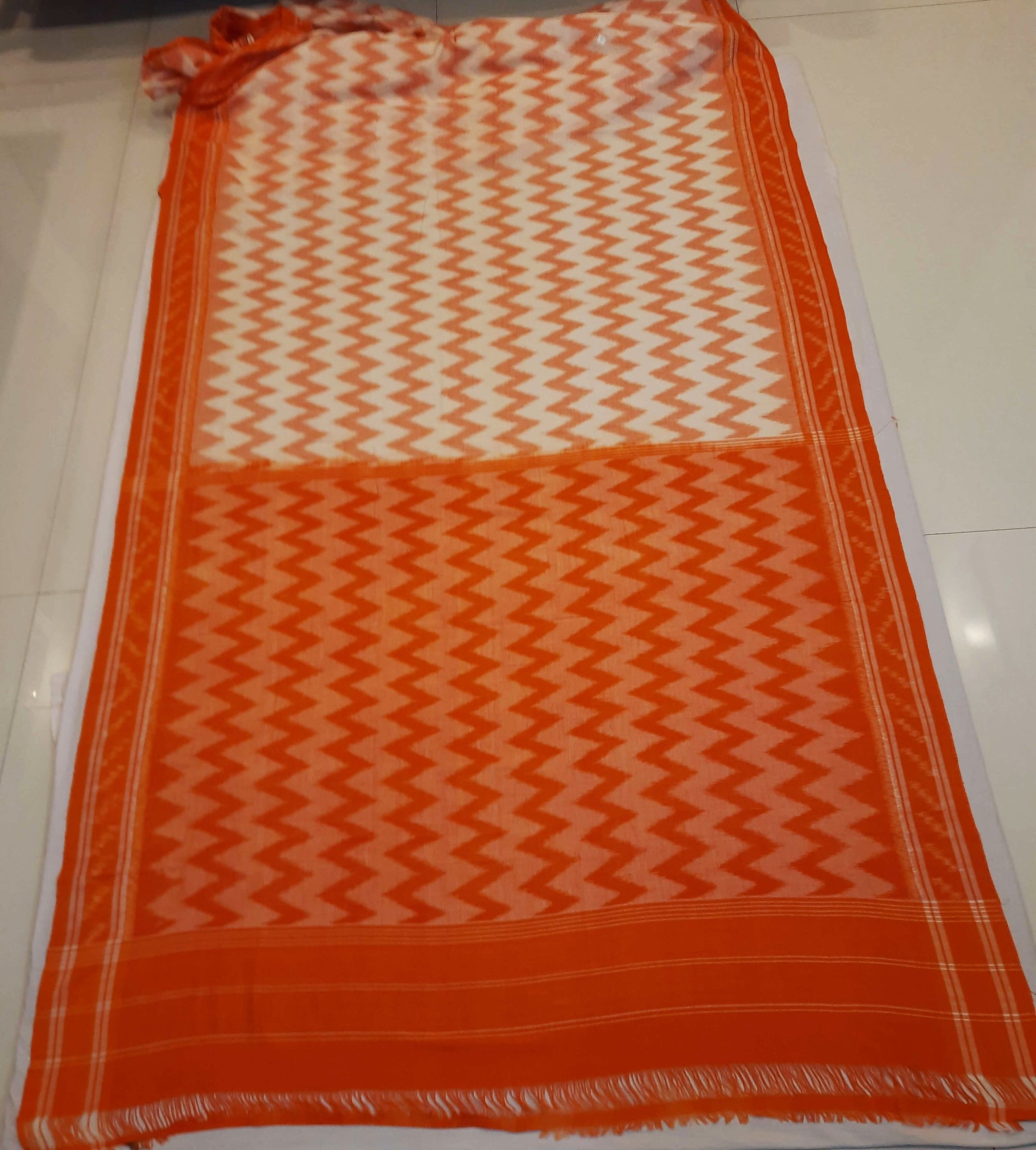 Off-white with Orange Cotton Odisha Ikat saree with mix match cotton ikat blouse piece