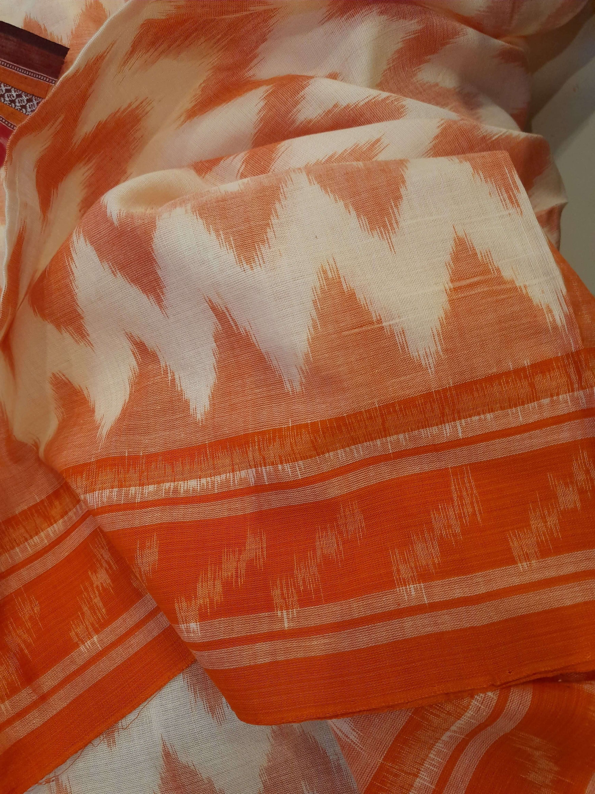 Off-white with Orange Cotton Odisha Ikat saree with mix match cotton ikat blouse piece