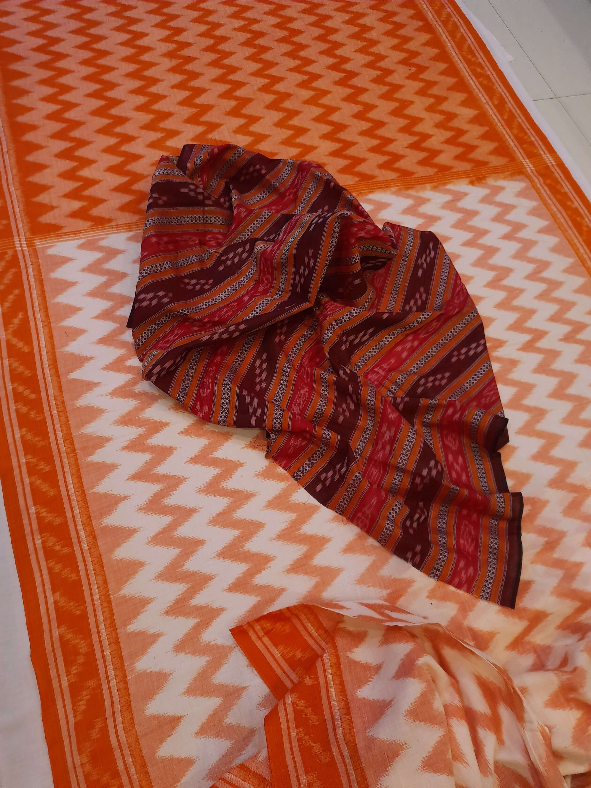 Off-white with Orange Cotton Odisha Ikat saree with mix match cotton ikat blouse piece