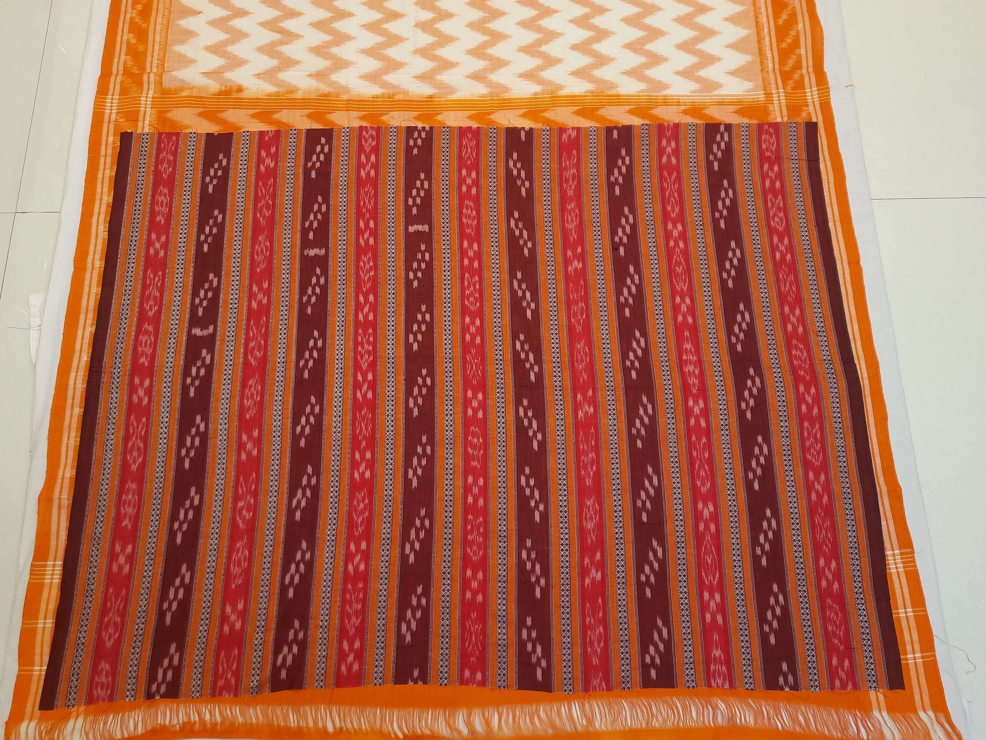 Off-white with Orange Cotton Odisha Ikat saree with mix match cotton ikat blouse piece