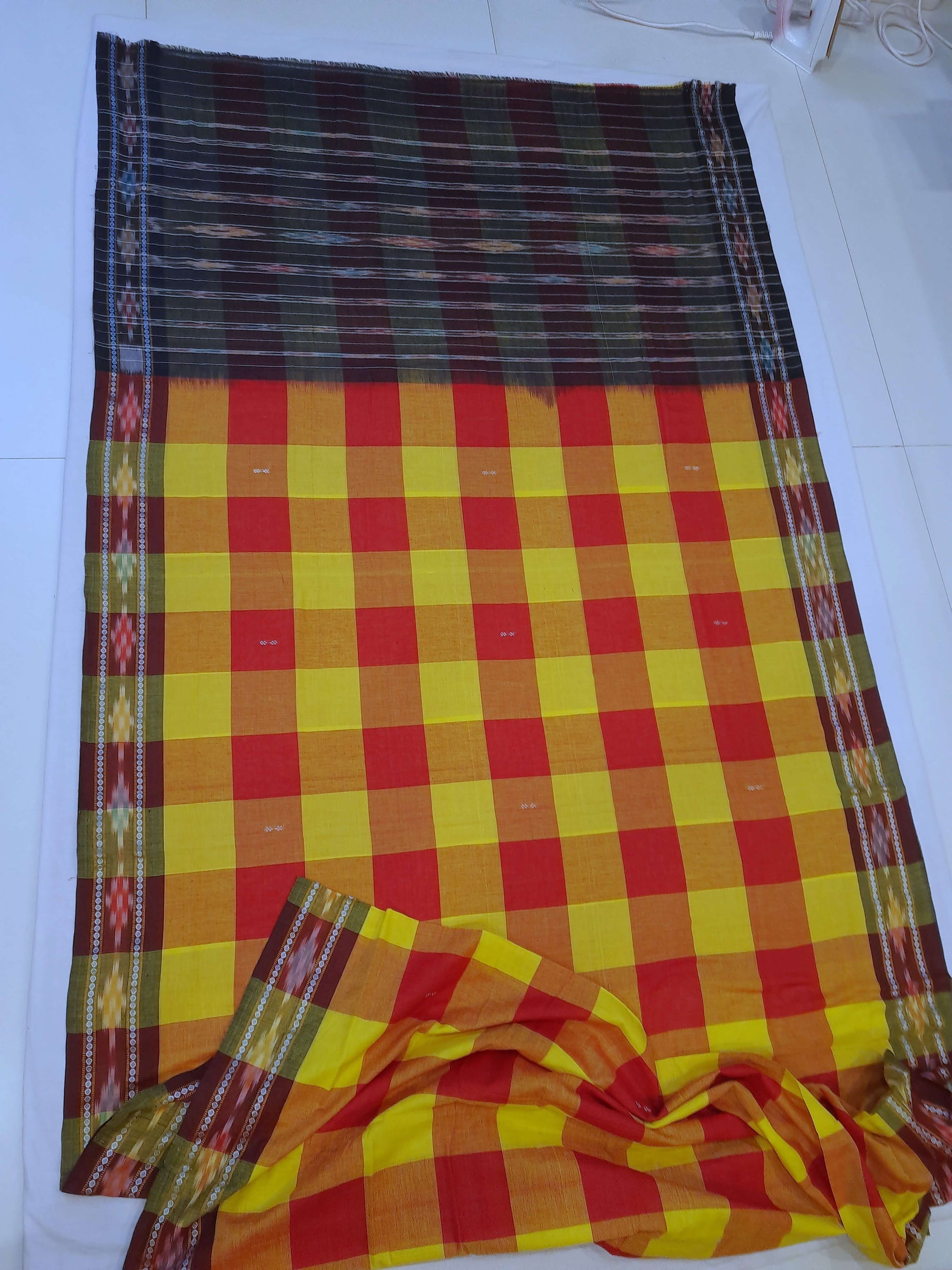 Yellow Red checkered body Odisha Ikat saree with cotton ikat blouse piece