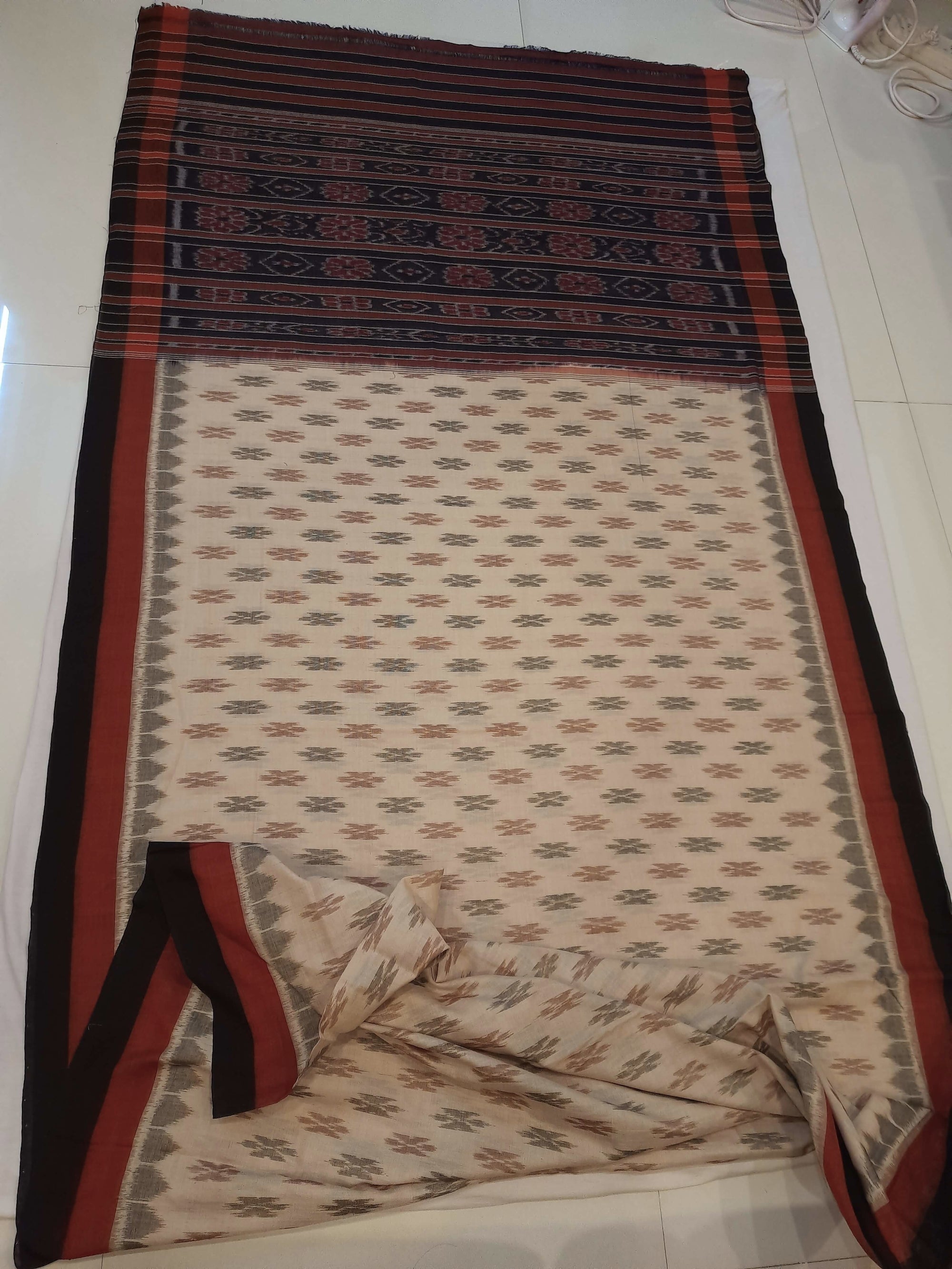 Beige cotton Odisha Ikat saree with cotton ikat blouse piece