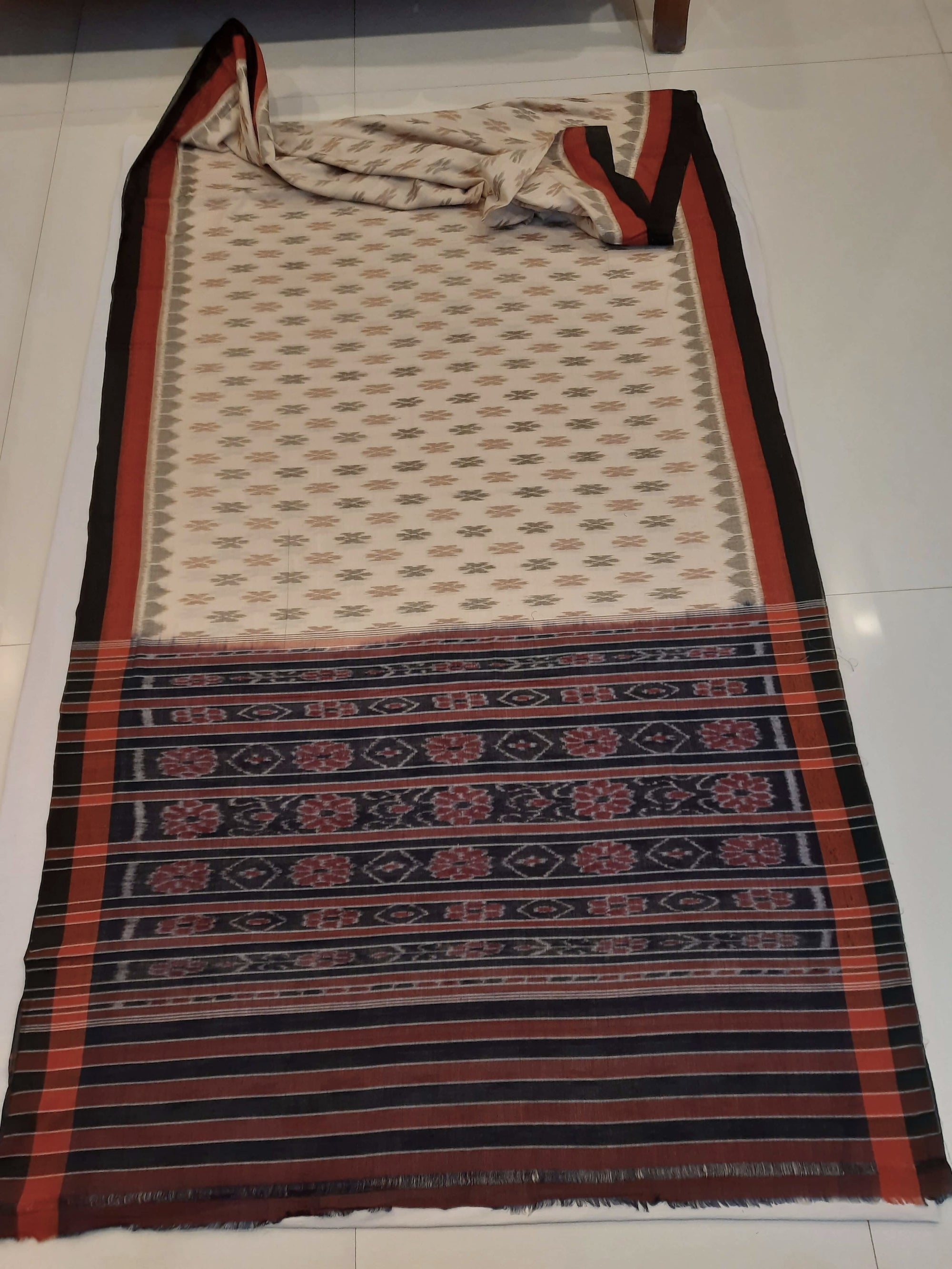 Beige cotton Odisha Ikat saree with cotton ikat blouse piece