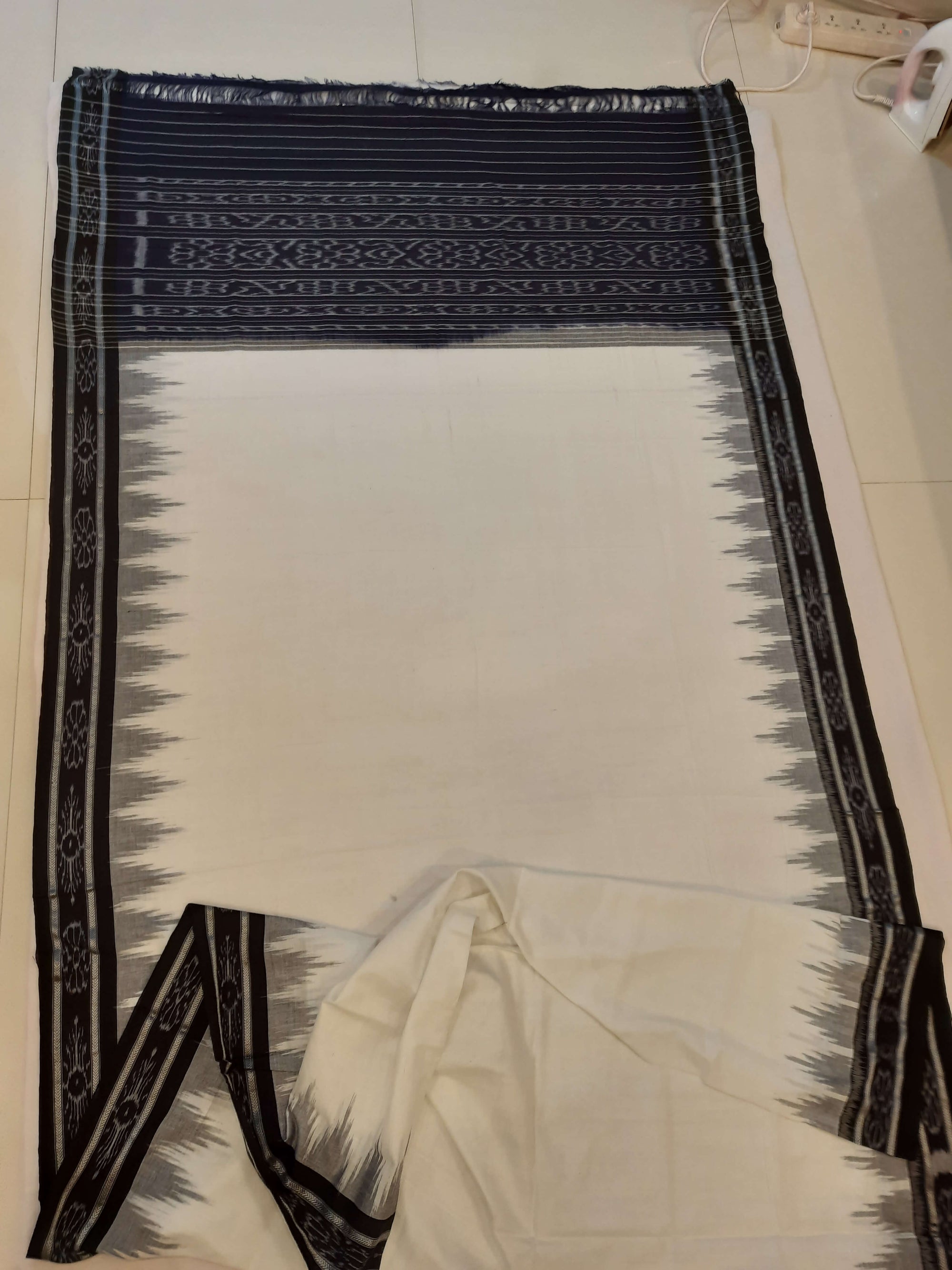 White and Black Odisha Ikat saree with cotton ikat blouse piece
