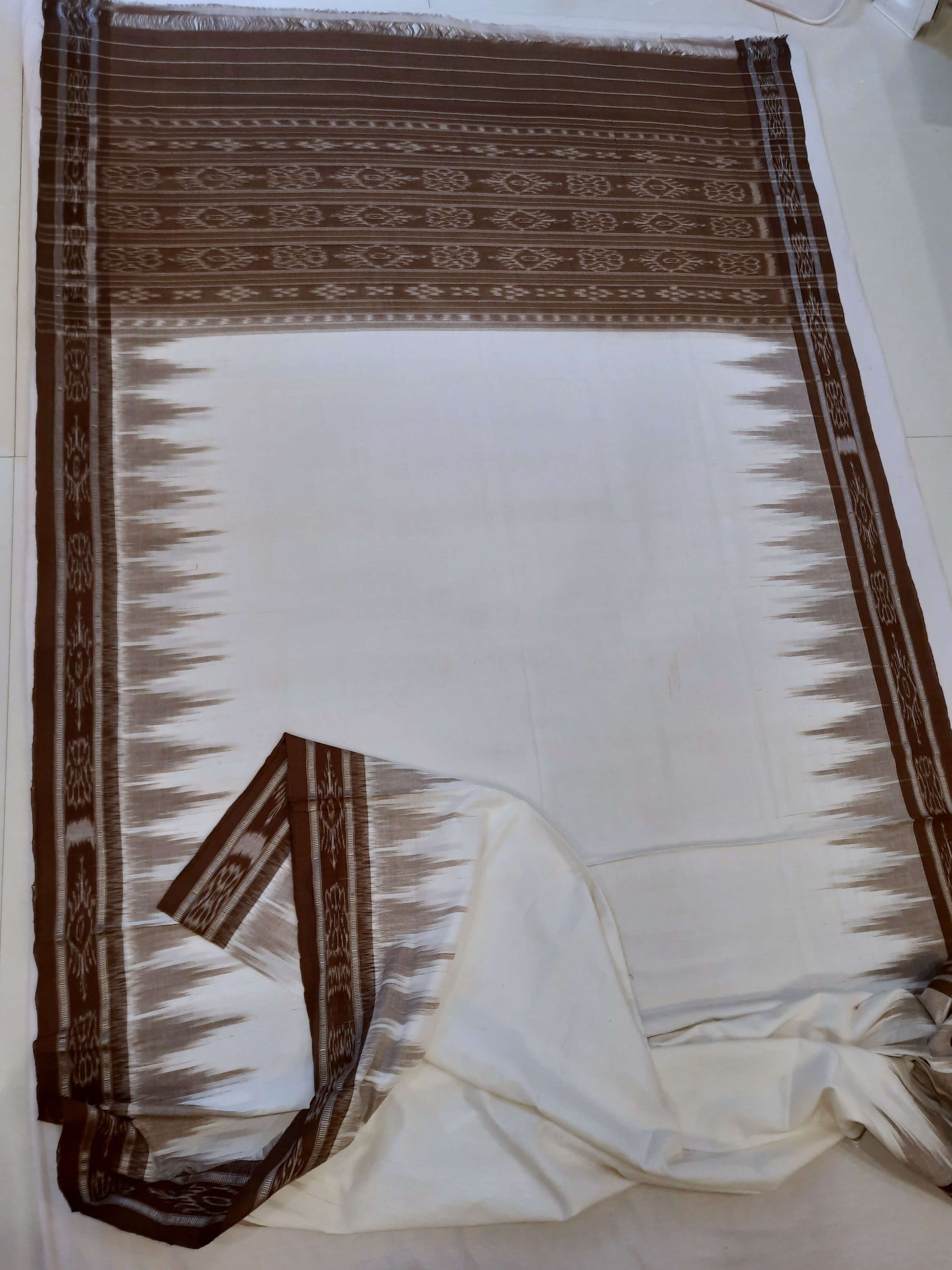 White and Brown coloured Odisha Ikat saree  with cotton ikat blouse piece