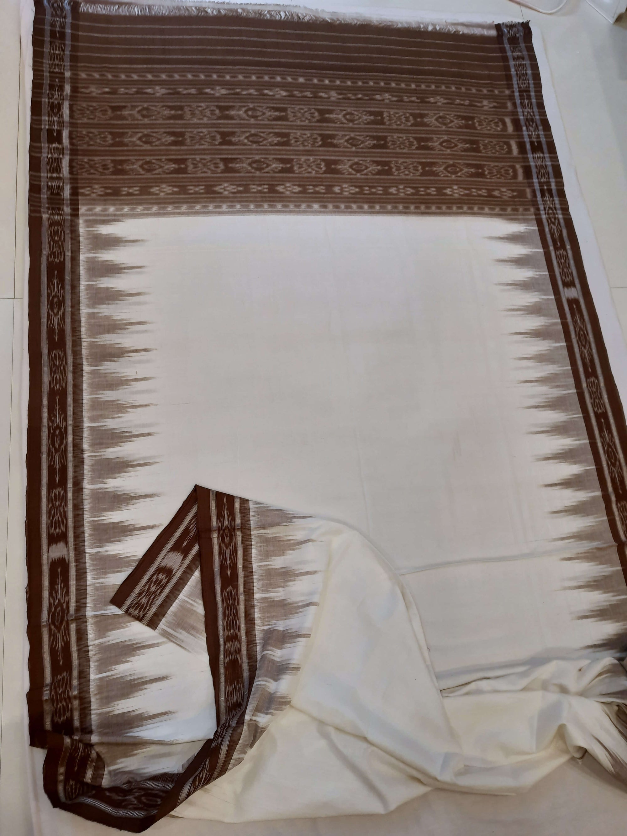 White and Brown Odisha Ikat saree with cotton ikat blouse piece